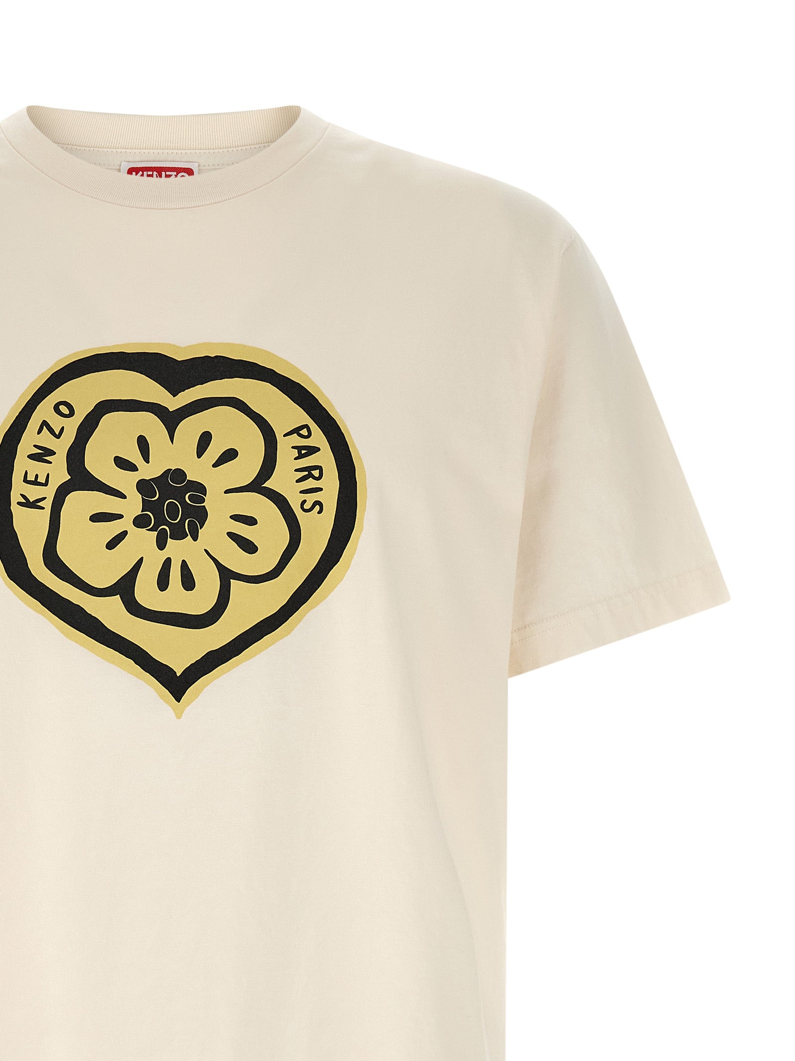Indulge in the KENZO Beige Cotton T-Shirt, a masterpiece of craftsmanship and iconic design, perfect for those who embrace elegance and self-expression.