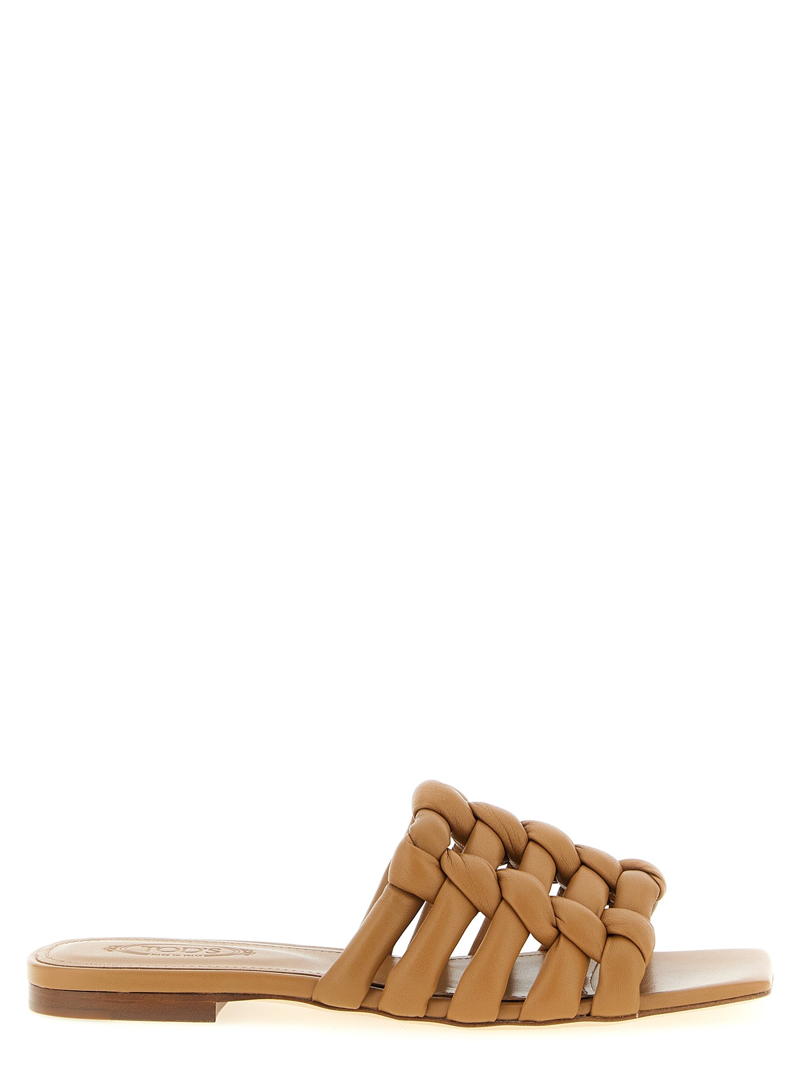 Discover the exquisite Tod's Brown Lambskin Slides, crafted from luxurious sheepskin leather, where timeless elegance meets Italian artistry for the discerning individual.