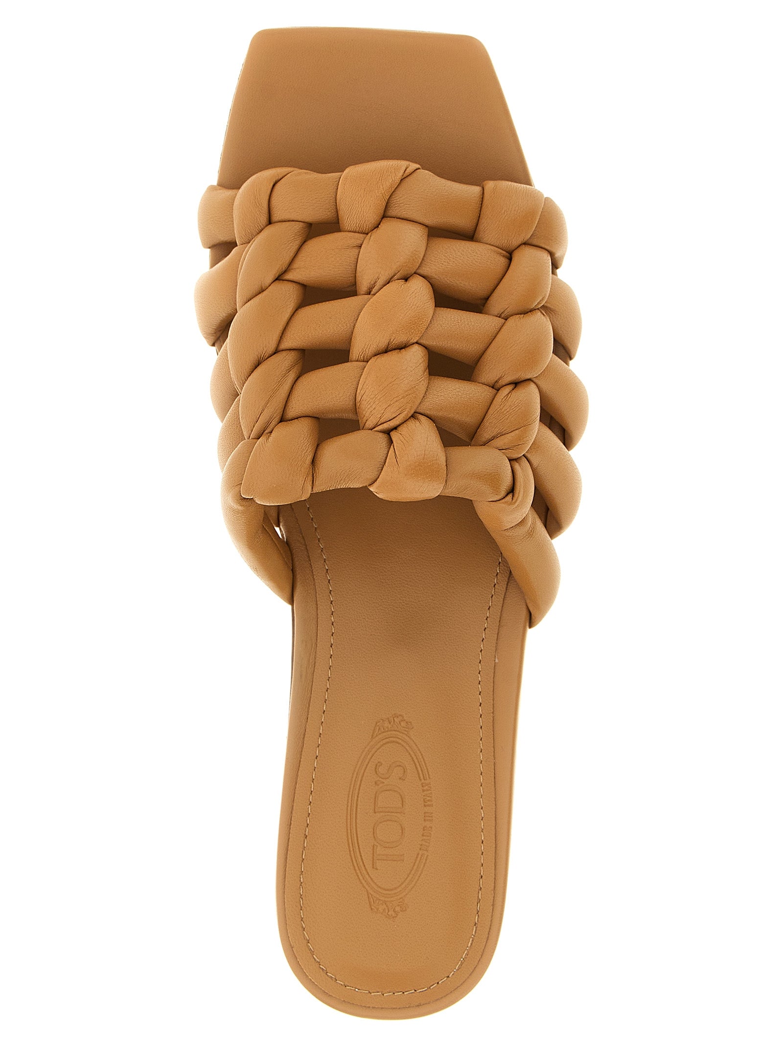 Elevate your style with Tod's Brown Lambskin Slides, crafted from exquisite sheepskin leather. Experience Italian craftsmanship that embodies luxury and sophistication.