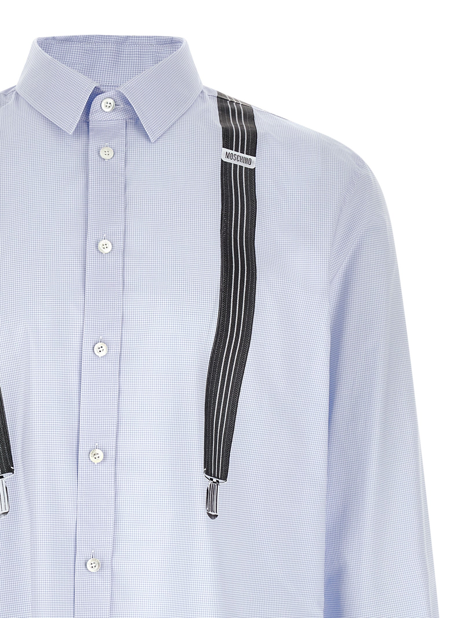 Discover the Moschino Blue Cotton Blouse, a masterpiece of Italian craftsmanship, blending playful artistry with luxurious comfort for a statement of refined elegance.