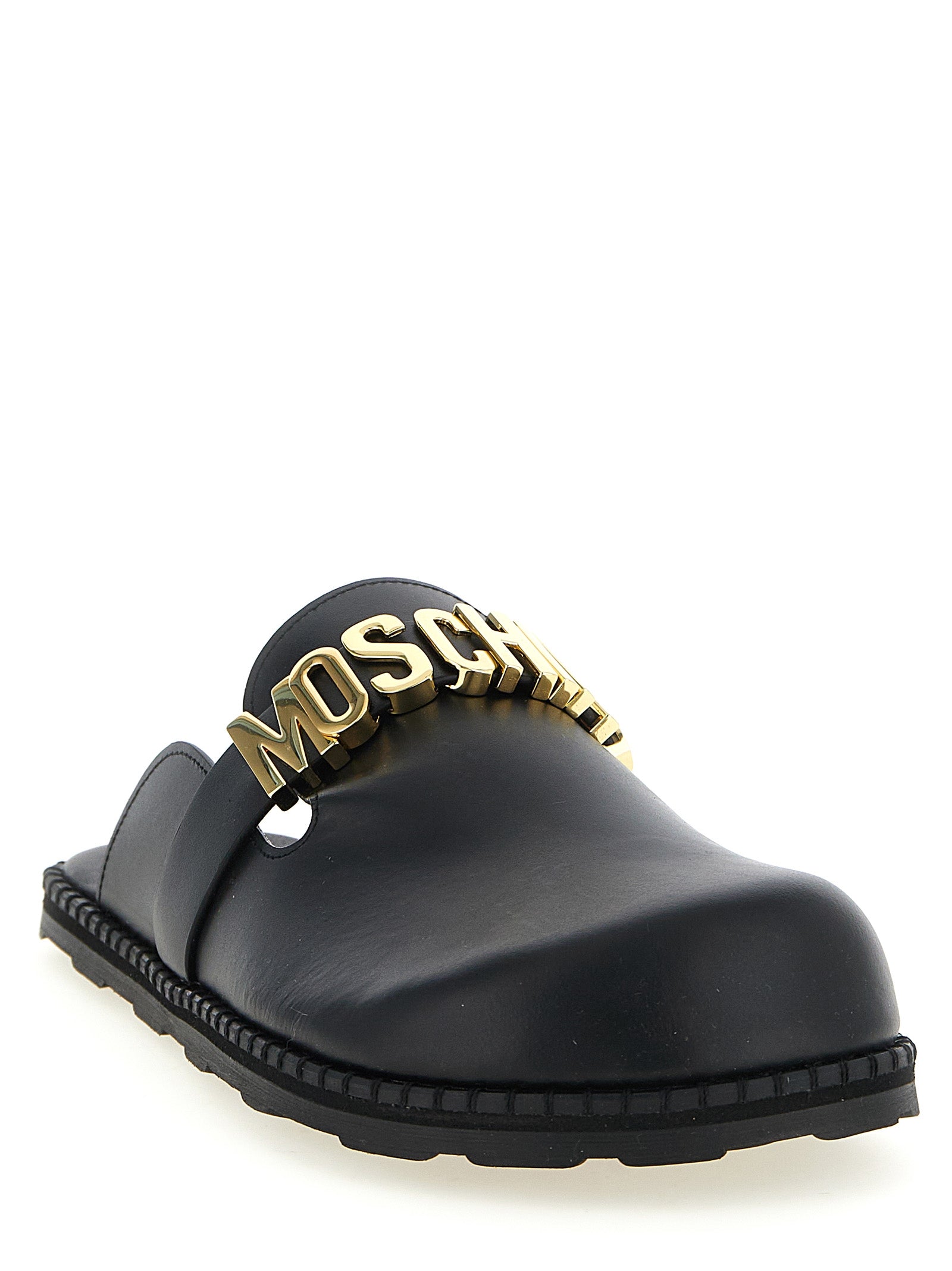Discover the Moschino Black Calfskin Clogs, where exquisite craftsmanship meets bold design, embodying luxury and sophistication for the discerning fashion connoisseur.