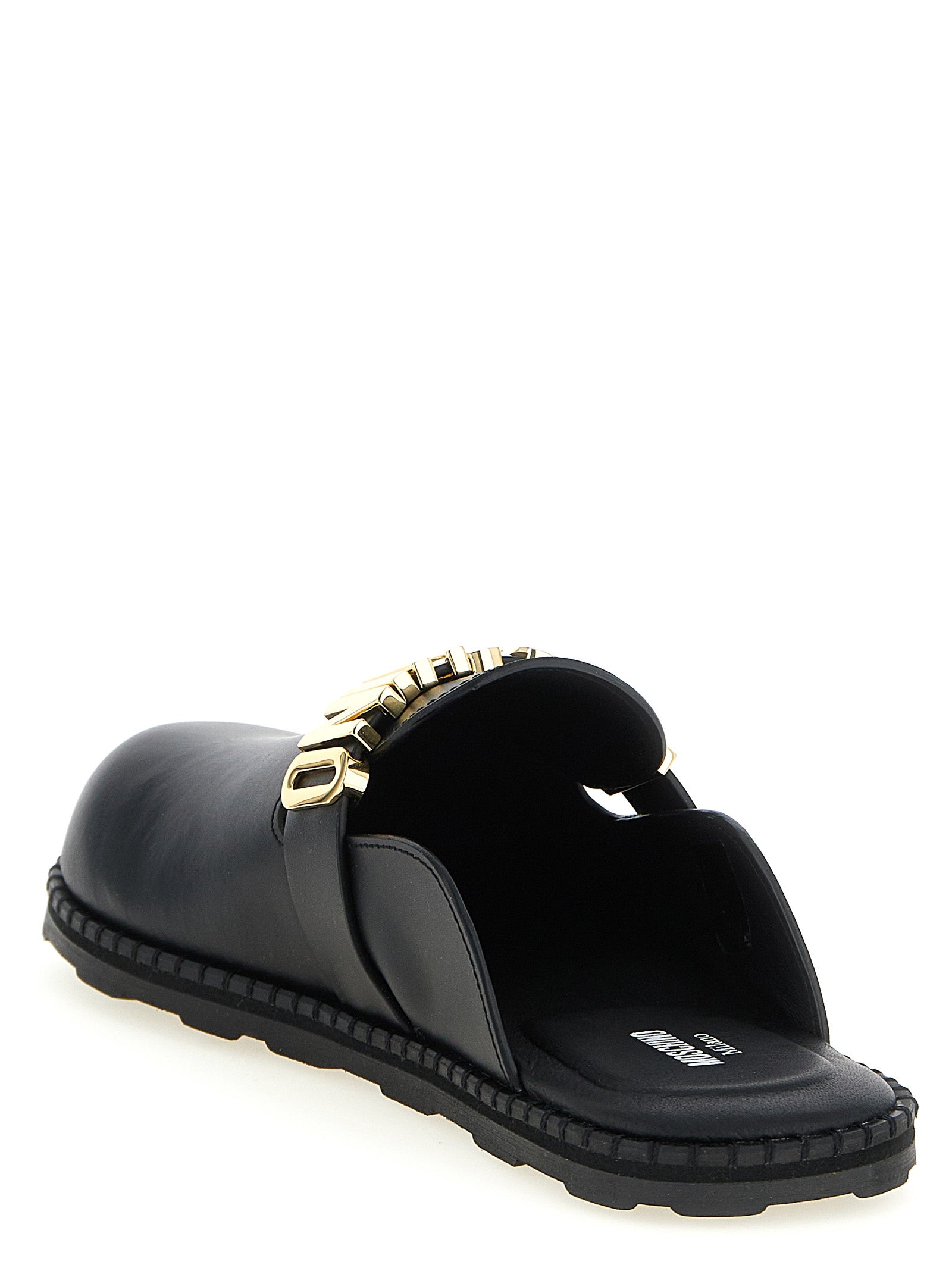 Experience the allure of Moschino Black Calfskin Clogs, where exquisite craftsmanship meets bold design, elevating your style to new heights of luxury.