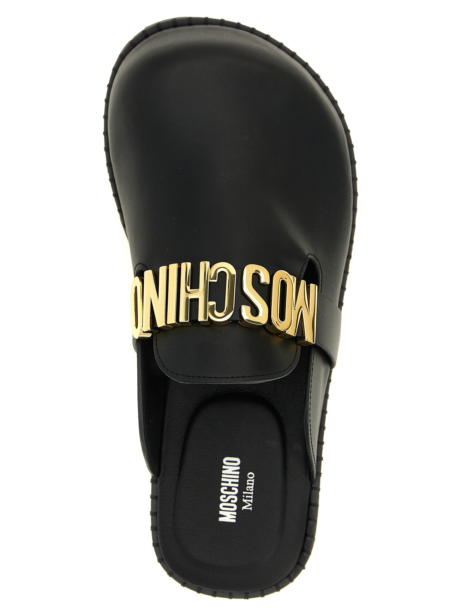 Experience the allure of Moschino Black Calfskin Clogs, where exquisite craftsmanship meets bold design, elevating your style to luxurious heights.