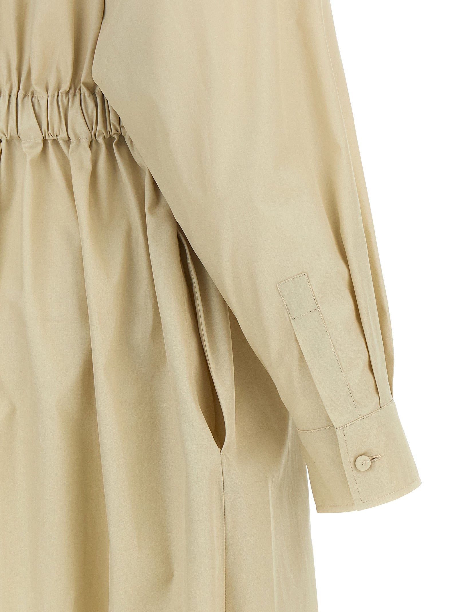 Indulge in the Max Mara Beige Cotton Long Dress, a masterpiece of Italian craftsmanship that embodies luxury and sophistication for any occasion.