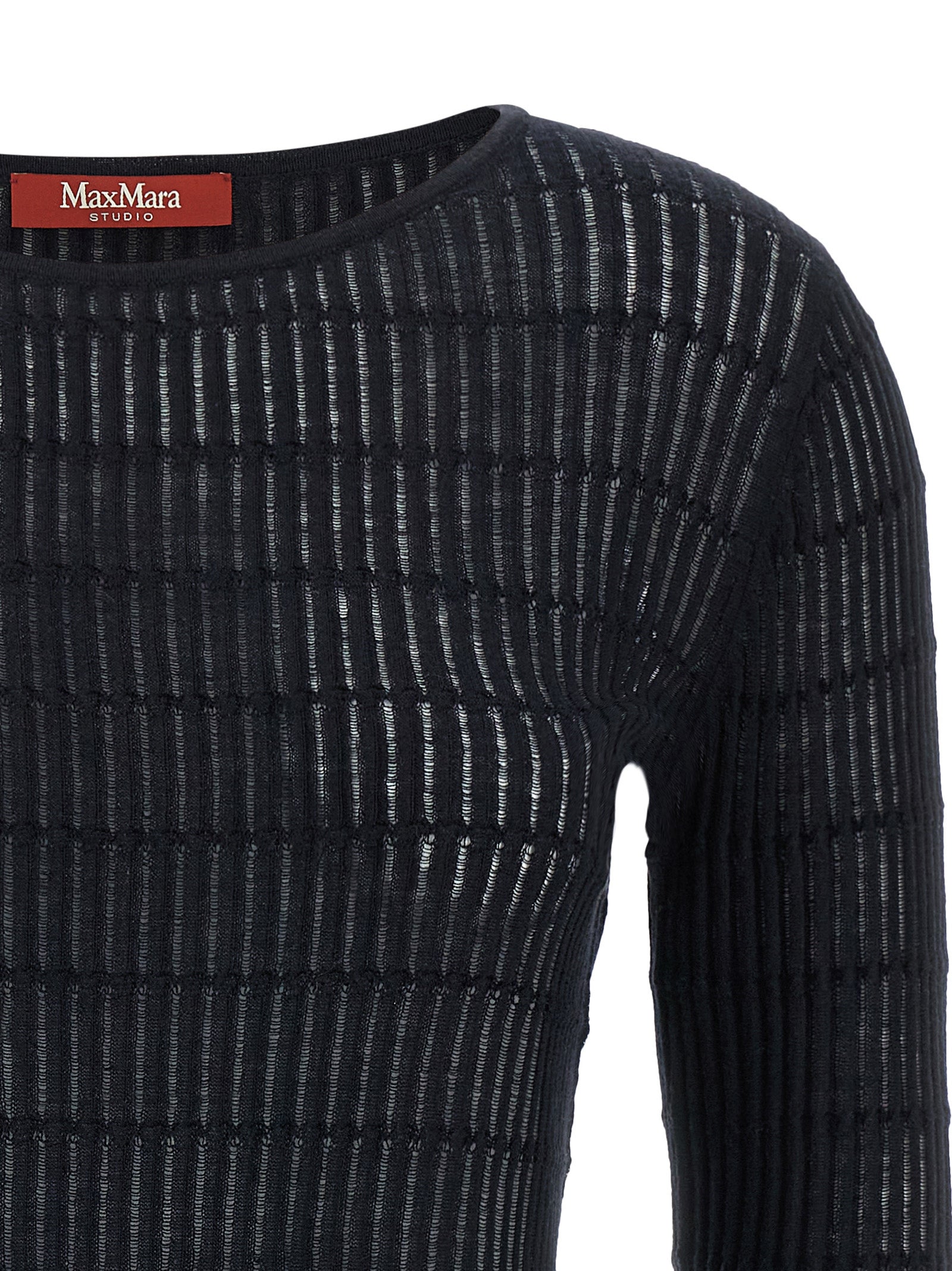 Indulge in the Max Mara Blue Silk Cardigan, a luxurious blend of silk and wool, embodying timeless elegance and contemporary sophistication for the discerning individual.