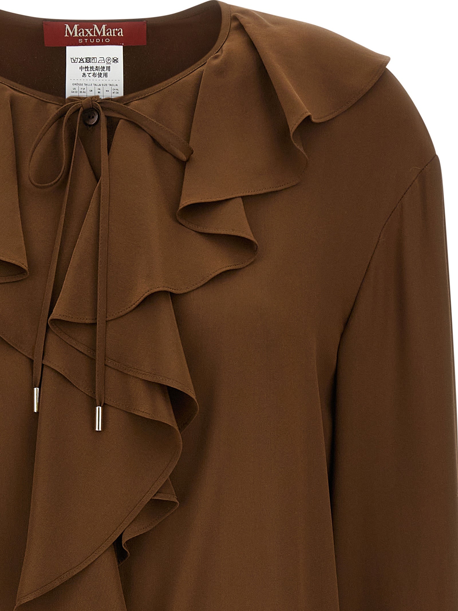 Elevate your wardrobe with the Max Mara Brown Silk Blouse, a masterpiece of artisanal craftsmanship in luxurious silk crêpe de Chine, embodying timeless elegance and sophistication.