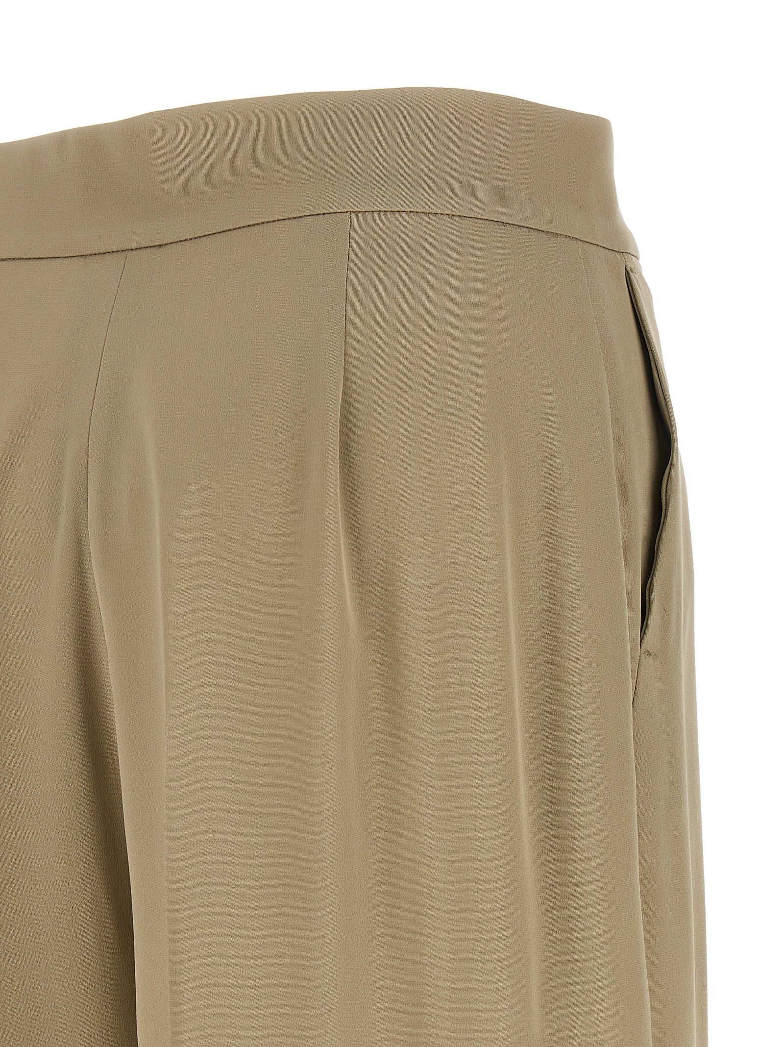 Experience the allure of Max Mara's Beige Silk Dress Pants, where artisanal craftsmanship meets luxurious silk for a timeless, sophisticated silhouette.