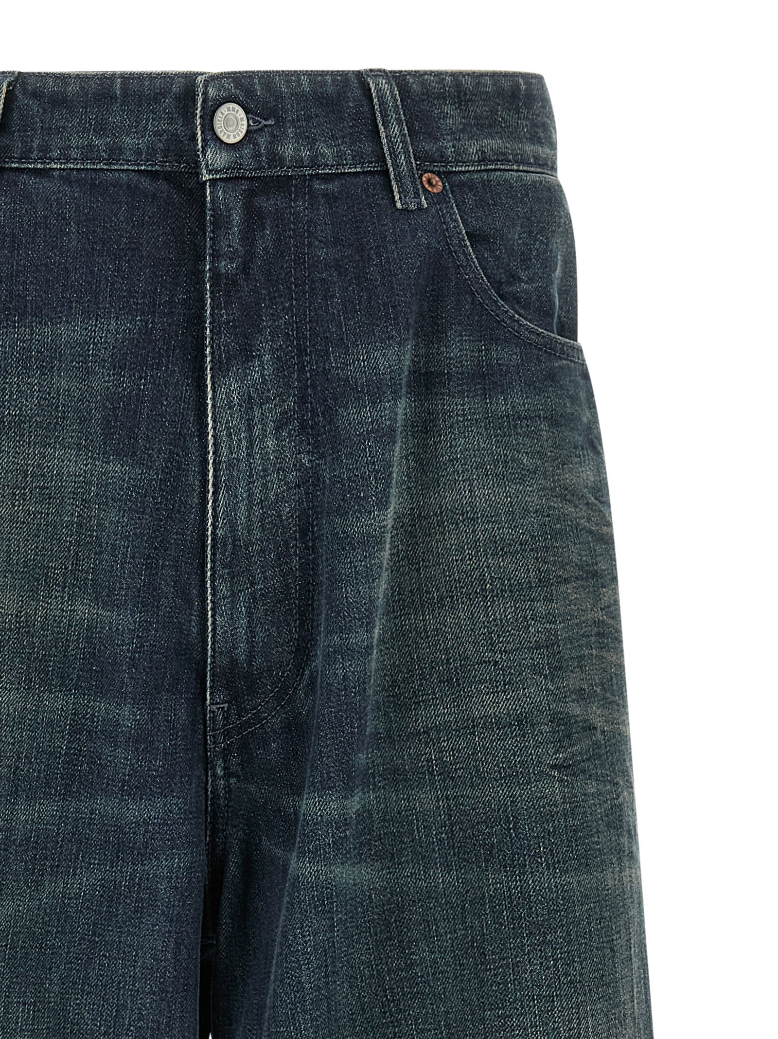 Indulge in the artisanal luxury of MM6 Maison Margiela's blue cotton jeans, where relaxed sophistication meets contemporary style, perfect for the discerning individual.