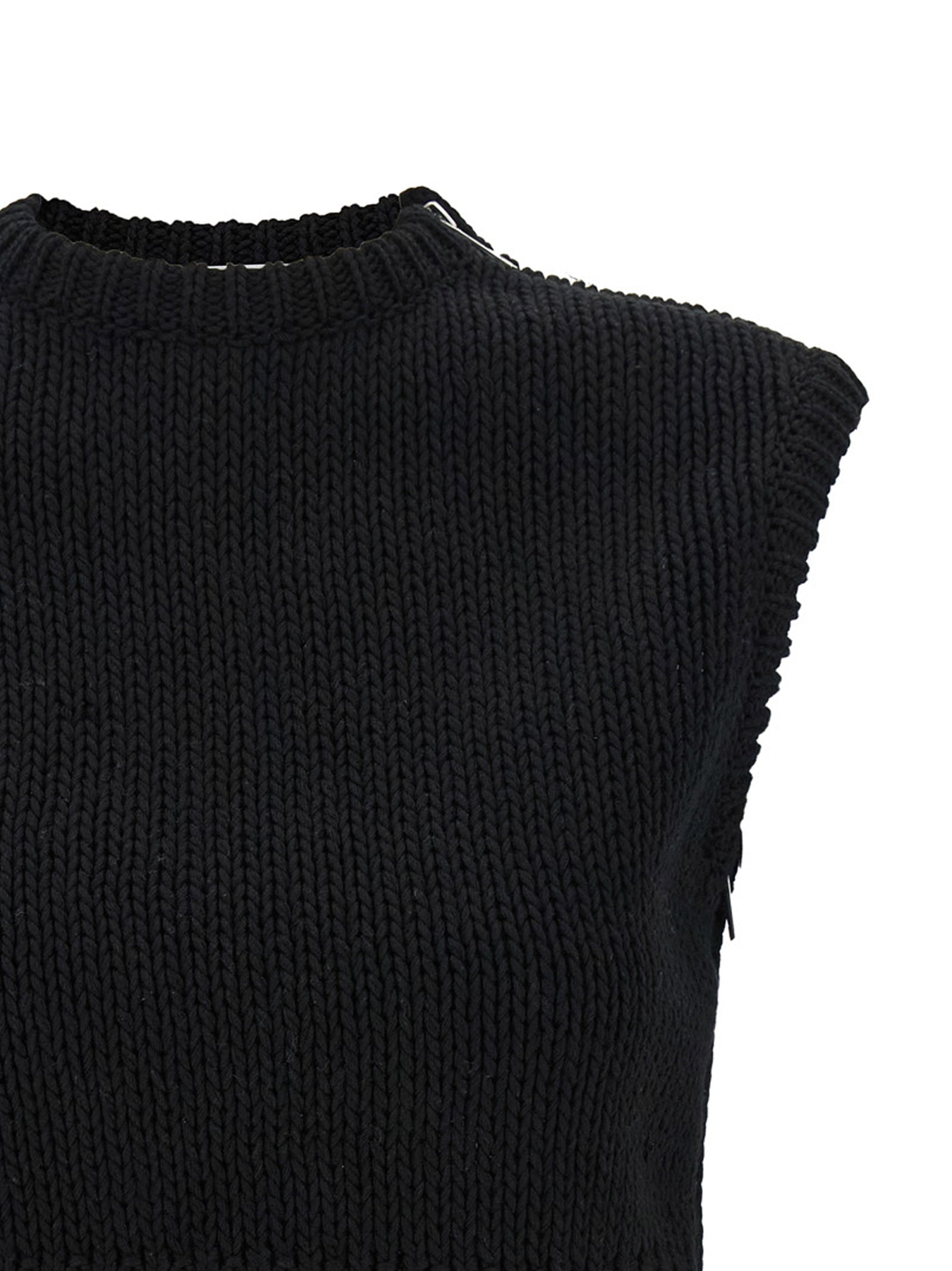 Elevate your style with the Max Mara Black Cotton Cardigan, a luxurious cropped piece that blends edgy design with Italian craftsmanship for timeless sophistication.