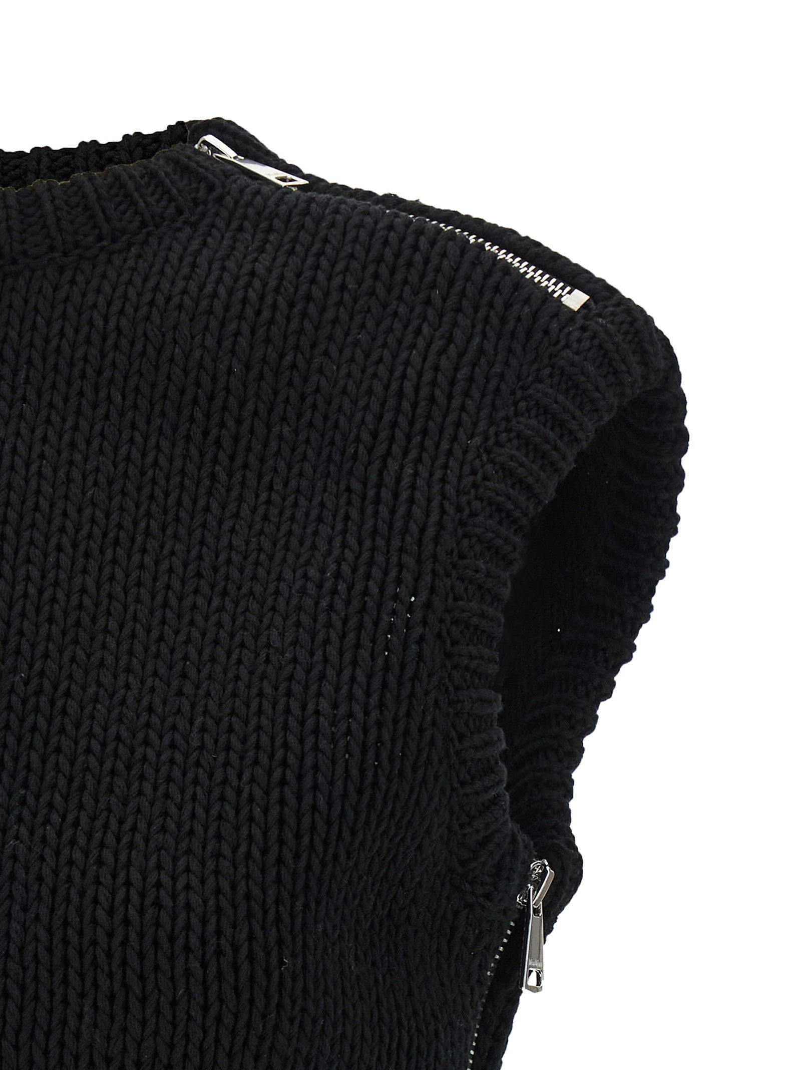 Elevate your style with the Max Mara Black Cotton Cardigan, a luxurious cropped piece crafted from fine cotton, merging edgy design with Italian artistry for timeless elegance.
