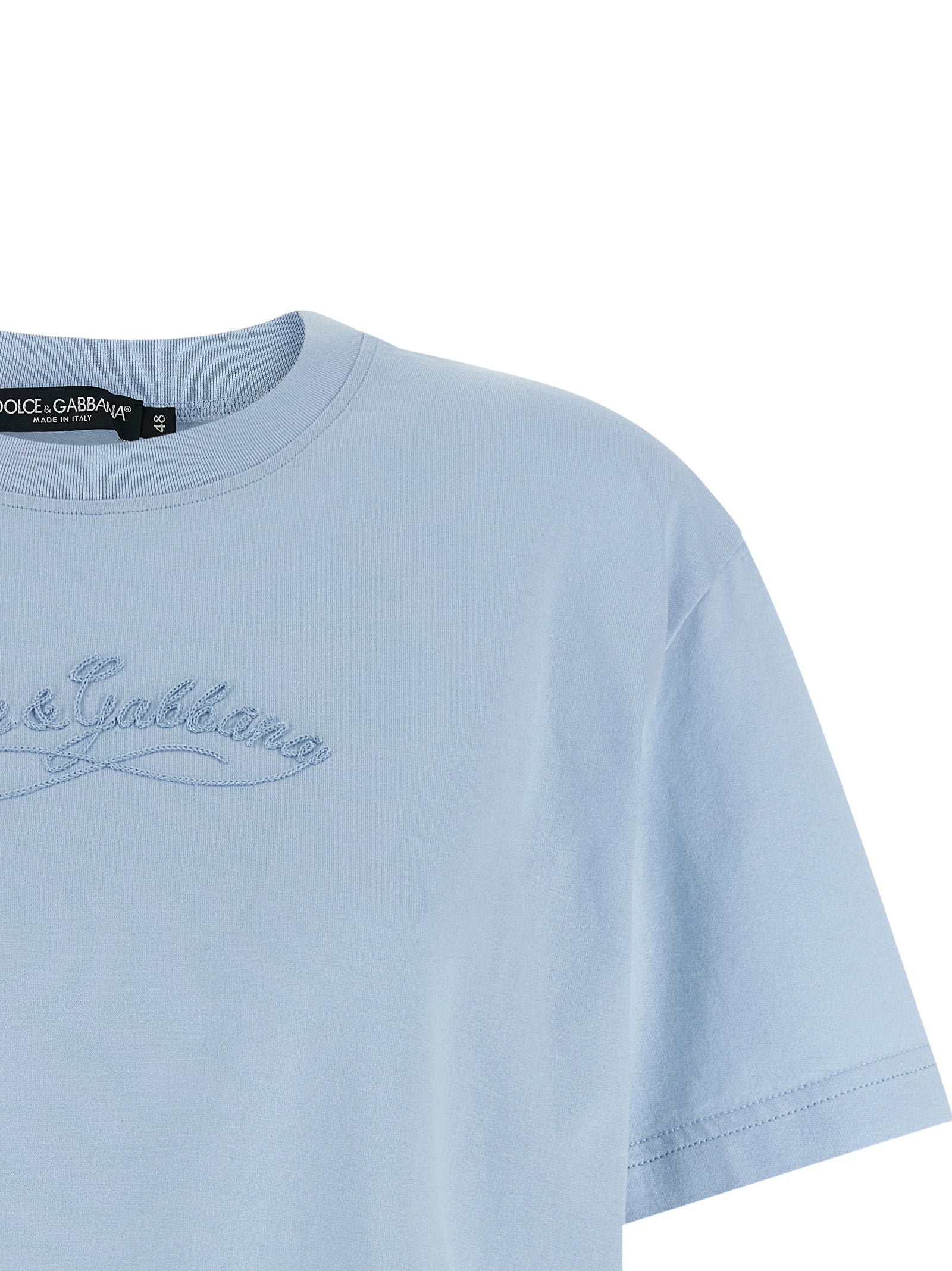 Elevate your wardrobe with the Dolce & Gabbana Blue Cotton T-Shirt, a masterpiece of Italian craftsmanship featuring exquisite tone-on-tone embroidery for timeless elegance.