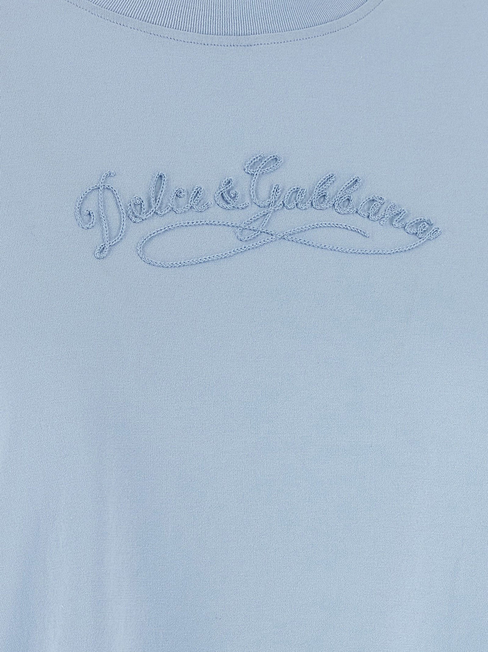 Elevate your style with the Dolce & Gabbana Blue Cotton T-Shirt, a masterpiece of Italian craftsmanship featuring exquisite tone-on-tone embroidery for timeless elegance.