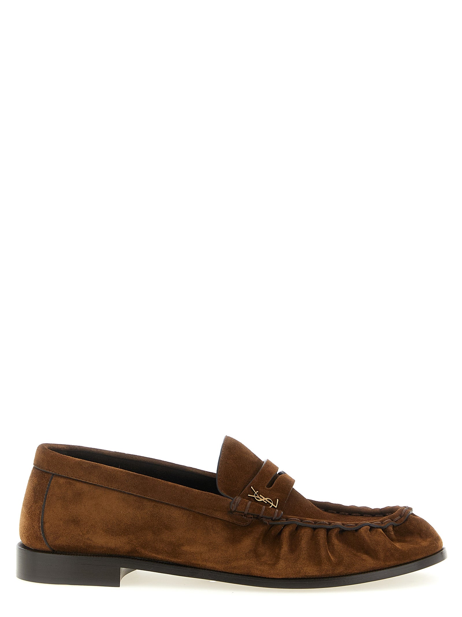 Experience the artisanal elegance of Saint Laurent's Brown Calfskin Slip-On Loafers, crafted in Italy for the discerning individual who appreciates timeless luxury and sophistication.