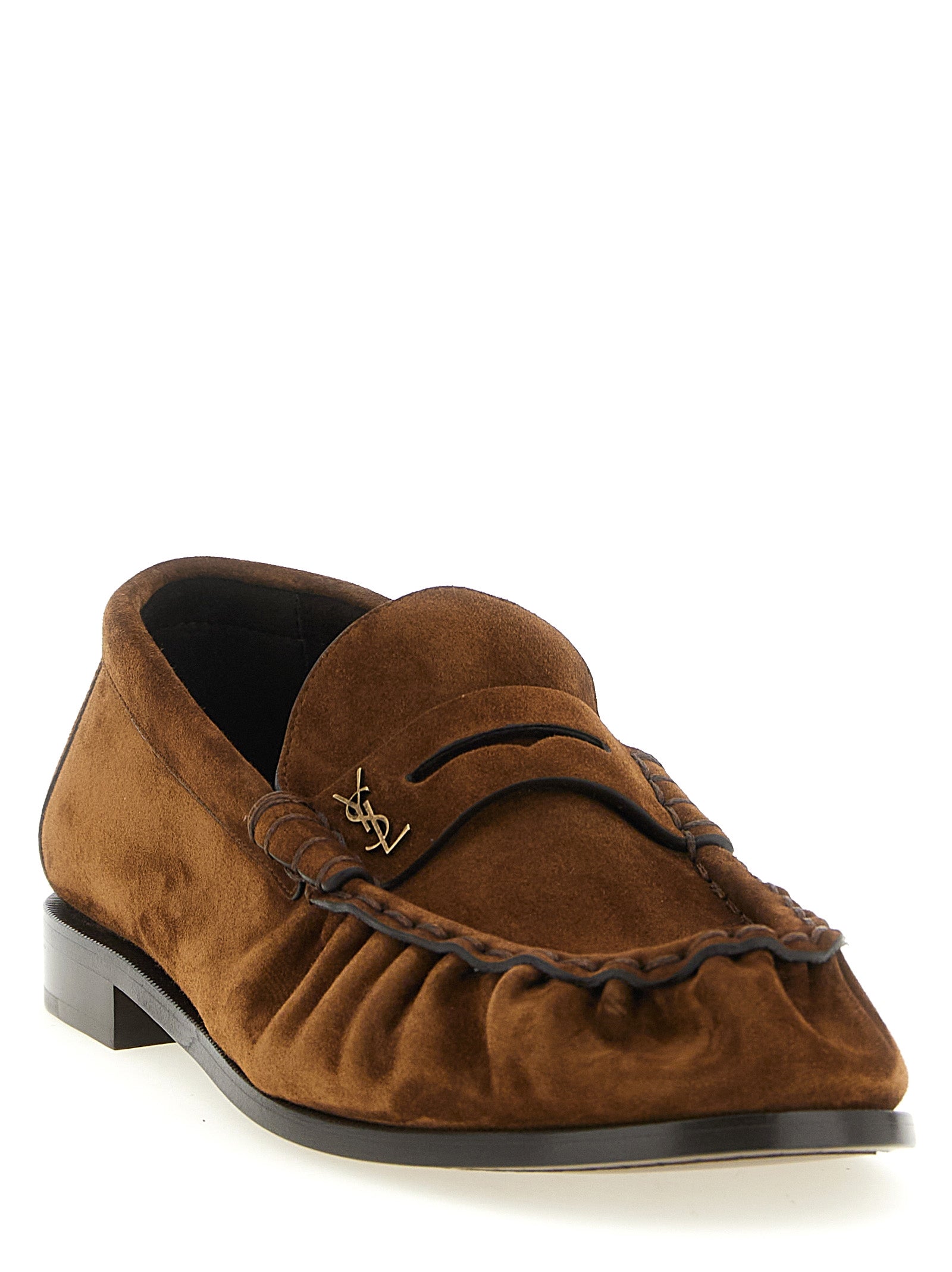 Experience the artisanal elegance of Saint Laurent's Brown Calfskin Slip-On Loafers, crafted in Italy from premium leather, embodying sophistication for the discerning individual.