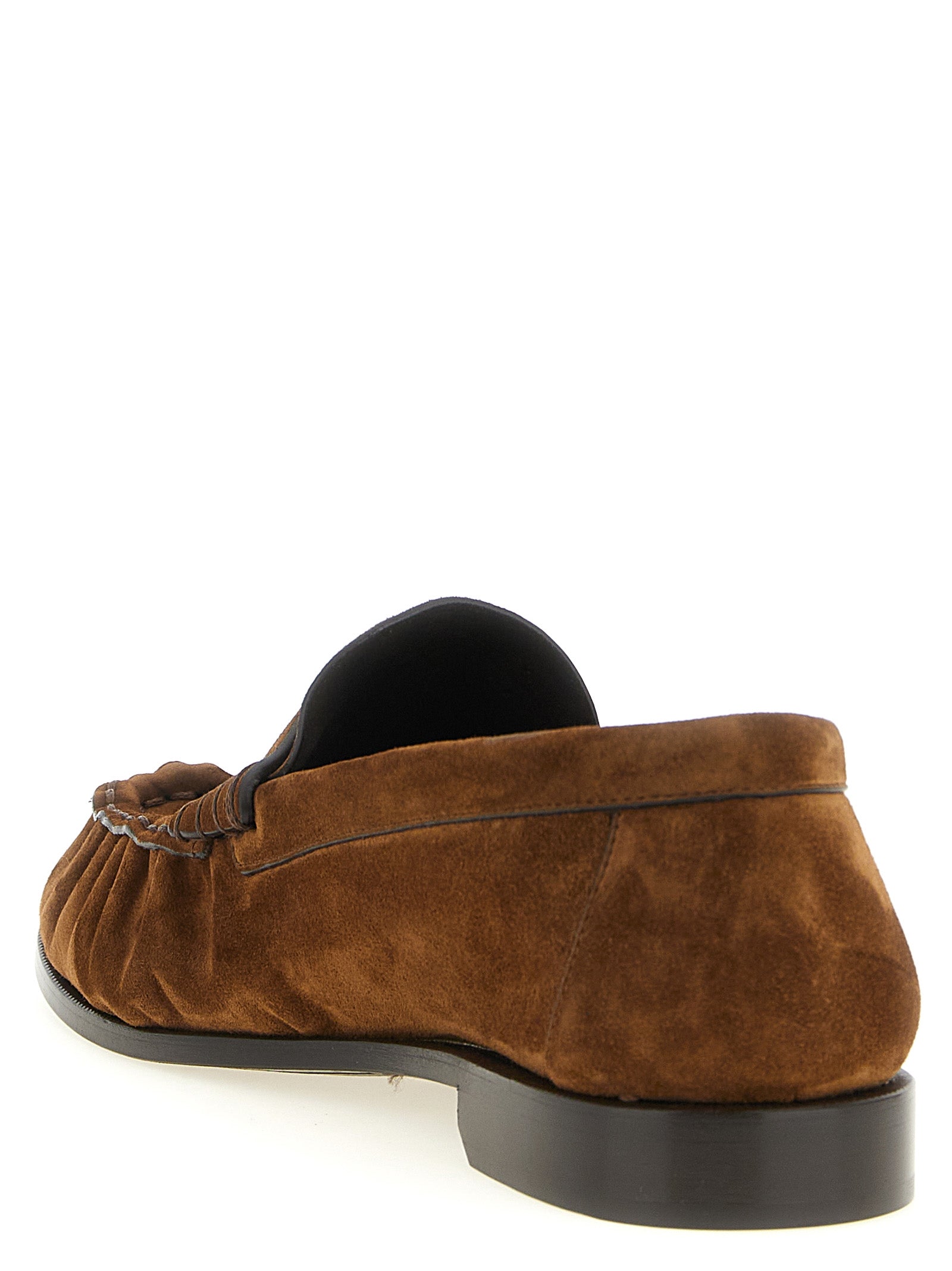 Experience the artisanal elegance of Saint Laurent's Brown Calfskin Slip-On Loafers, crafted from premium leather in Italy, embodying sophistication and timeless luxury.