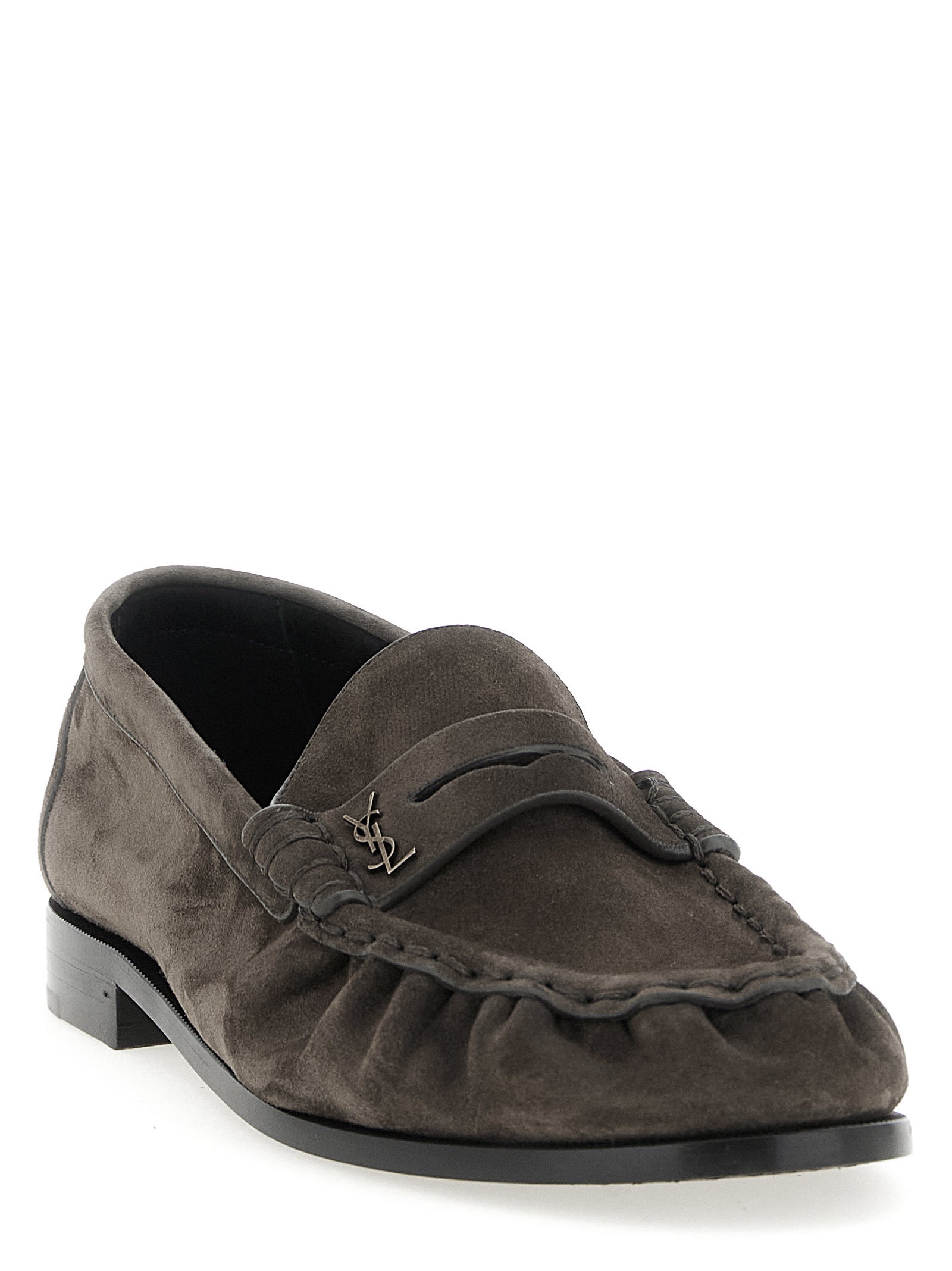 Indulge in the artisanal elegance of Saint Laurent's Brown Calfskin Slip-On Loafers, where exquisite craftsmanship meets timeless sophistication for the discerning individual.