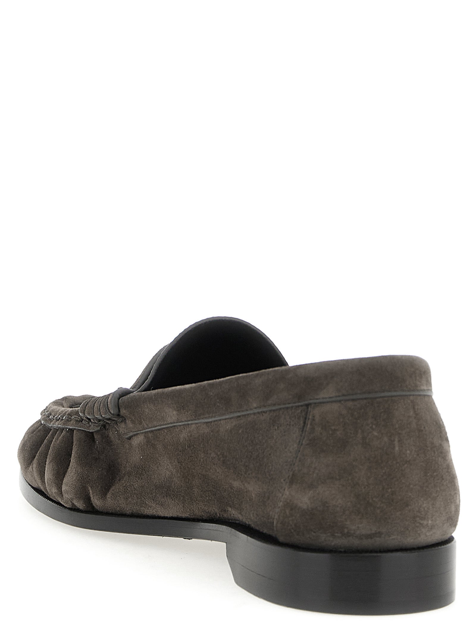 Elevate your style with Saint Laurent's Brown Calfskin Slip-On Loafers, a testament to artisanal craftsmanship and timeless elegance, perfect for discerning tastes.
