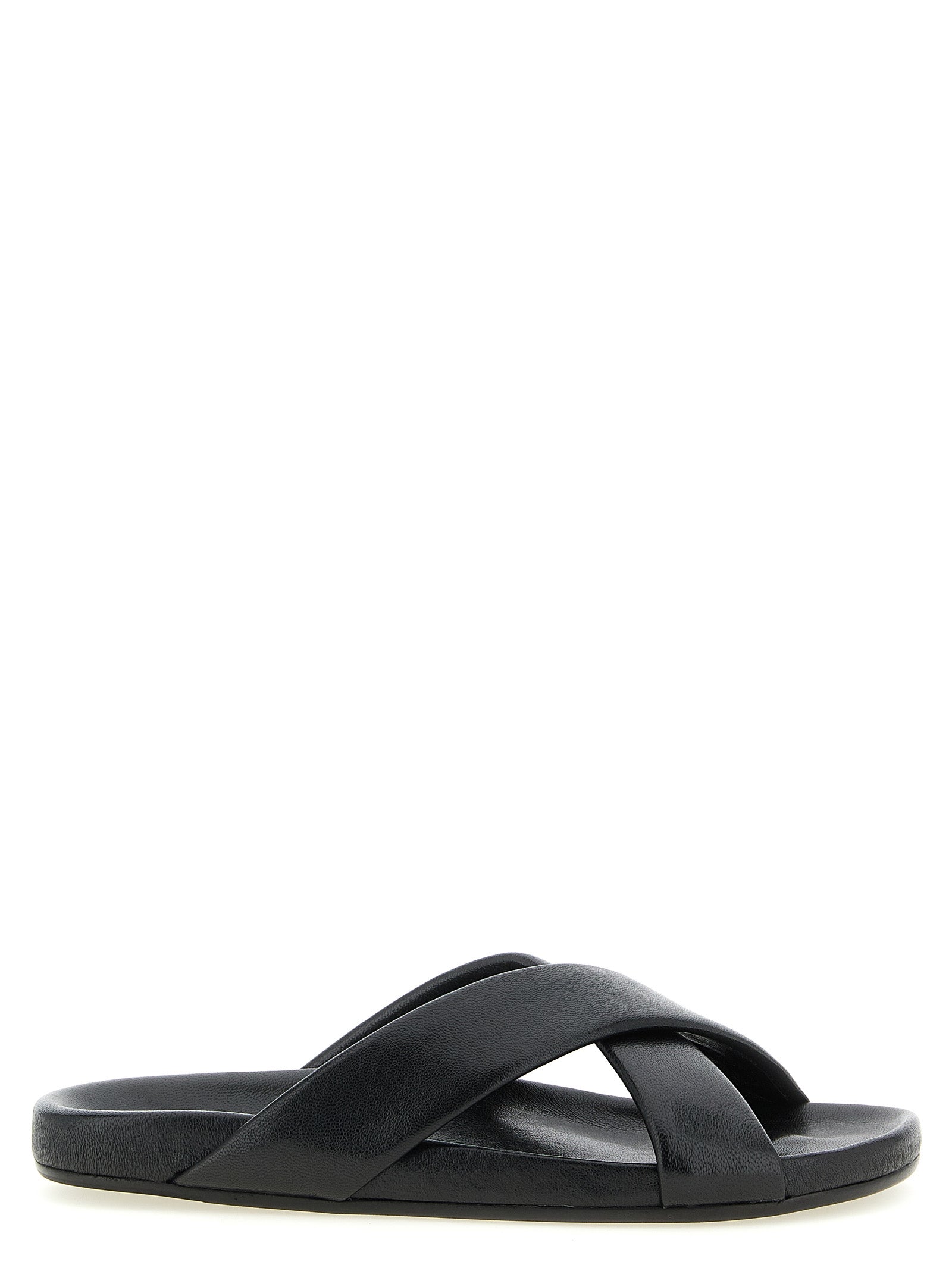 Experience the exquisite allure of Saint Laurent Black Lamb Leather Slides, handcrafted in Italy from luxurious lamb leather, embodying timeless elegance and sophistication.