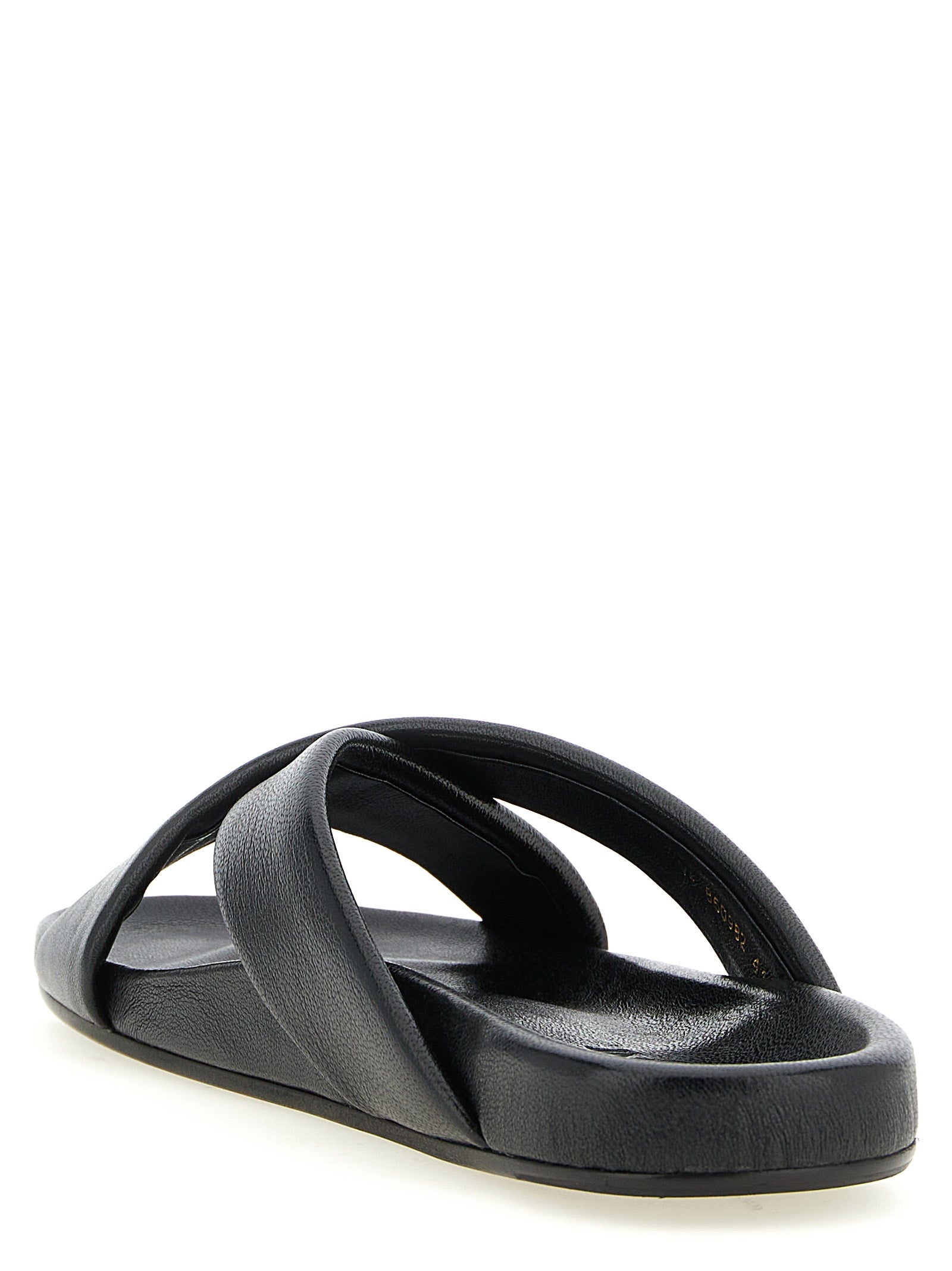 Experience the epitome of luxury with Saint Laurent Black Lamb Leather Slides, handcrafted in Italy from exquisite lamb leather, perfect for elevating any ensemble.