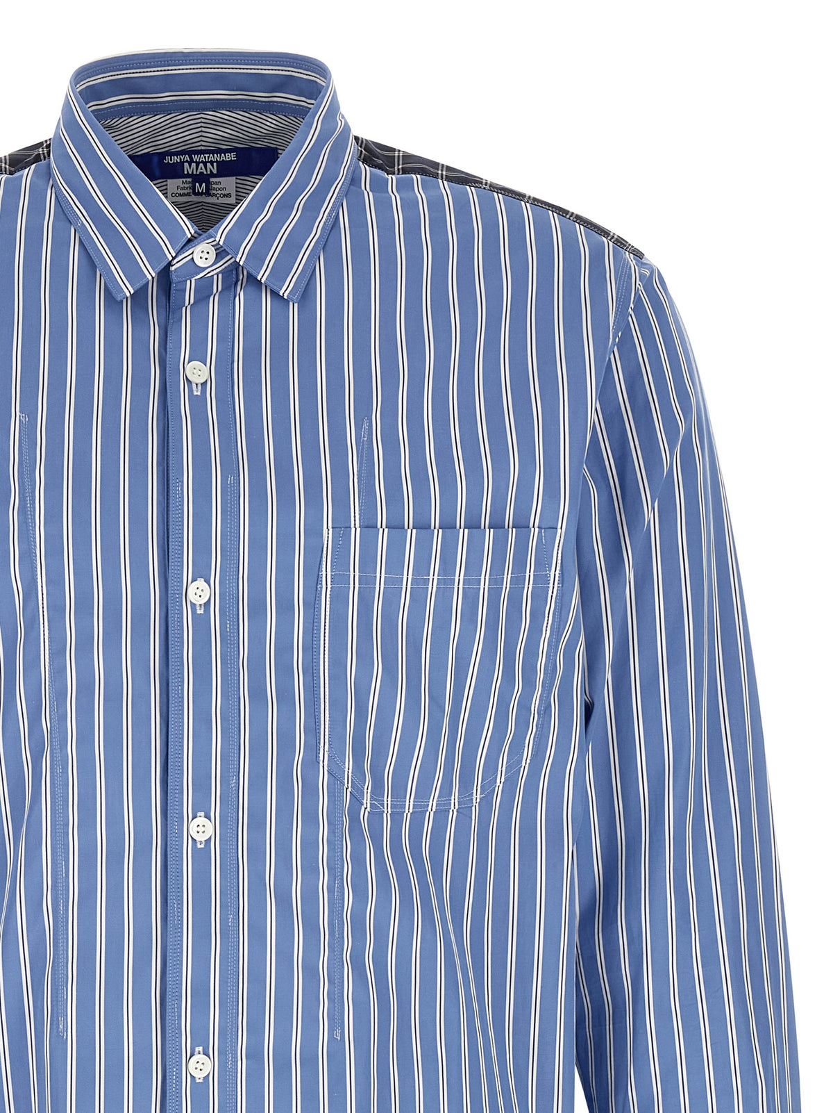 Discover the Junya Watanabe Blue Cotton Blouse, a masterpiece of avant-garde design and luxurious craftsmanship, perfect for those who embody elegance and sophistication.