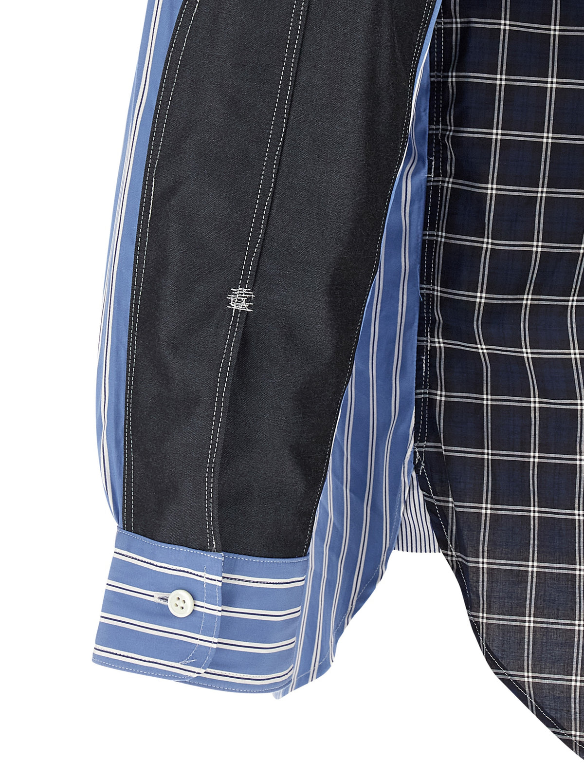 Elevate your wardrobe with the Junya Watanabe Blue Cotton Blouse, a masterpiece of avant-garde design and luxurious craftsmanship, perfect for any occasion.