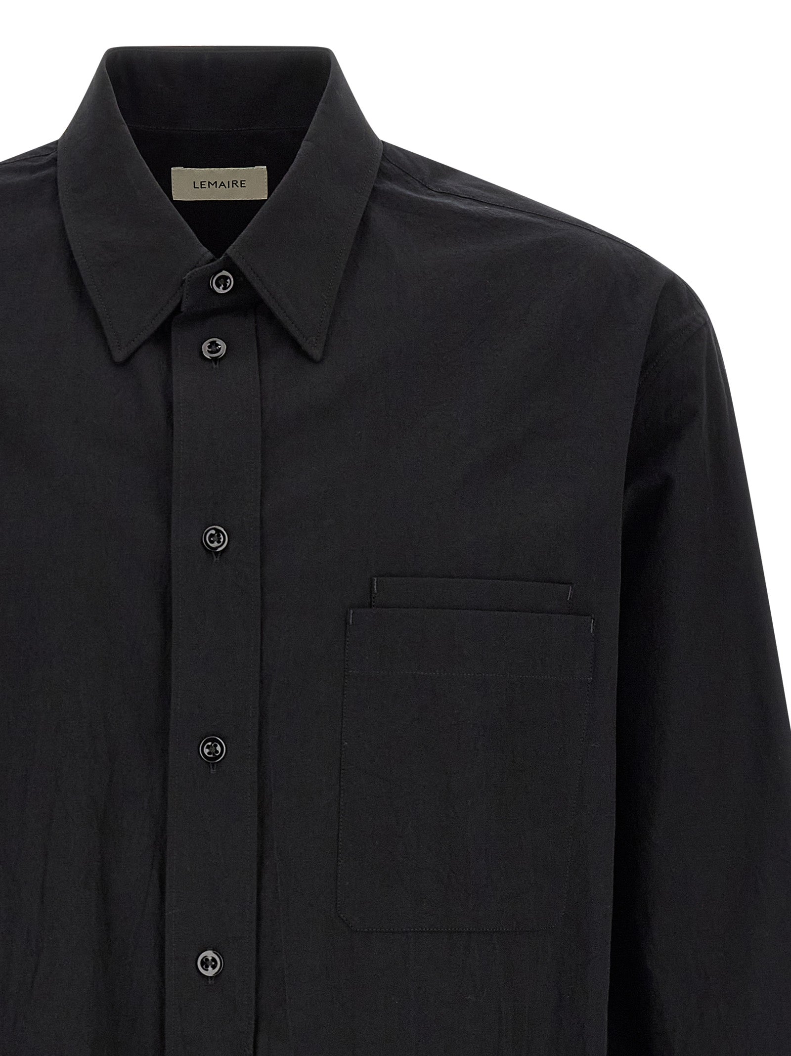 Elevate your wardrobe with Lemaire's Black Cotton Blouse, a luxurious blend of timeless elegance and contemporary design, perfect for any sophisticated occasion.