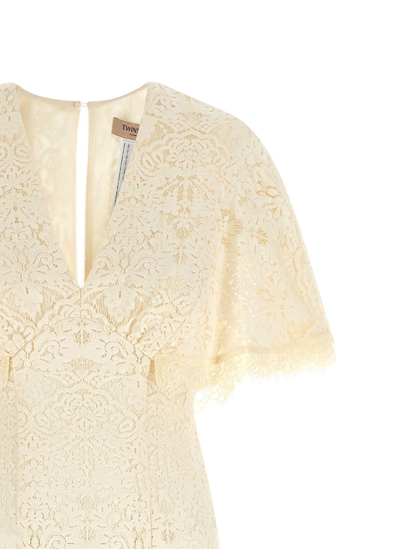 Discover the Twinset White Cotton Long Dress, a masterpiece of luxurious elegance, crafted from a sumptuous blend of fine materials, perfect for unforgettable moments.