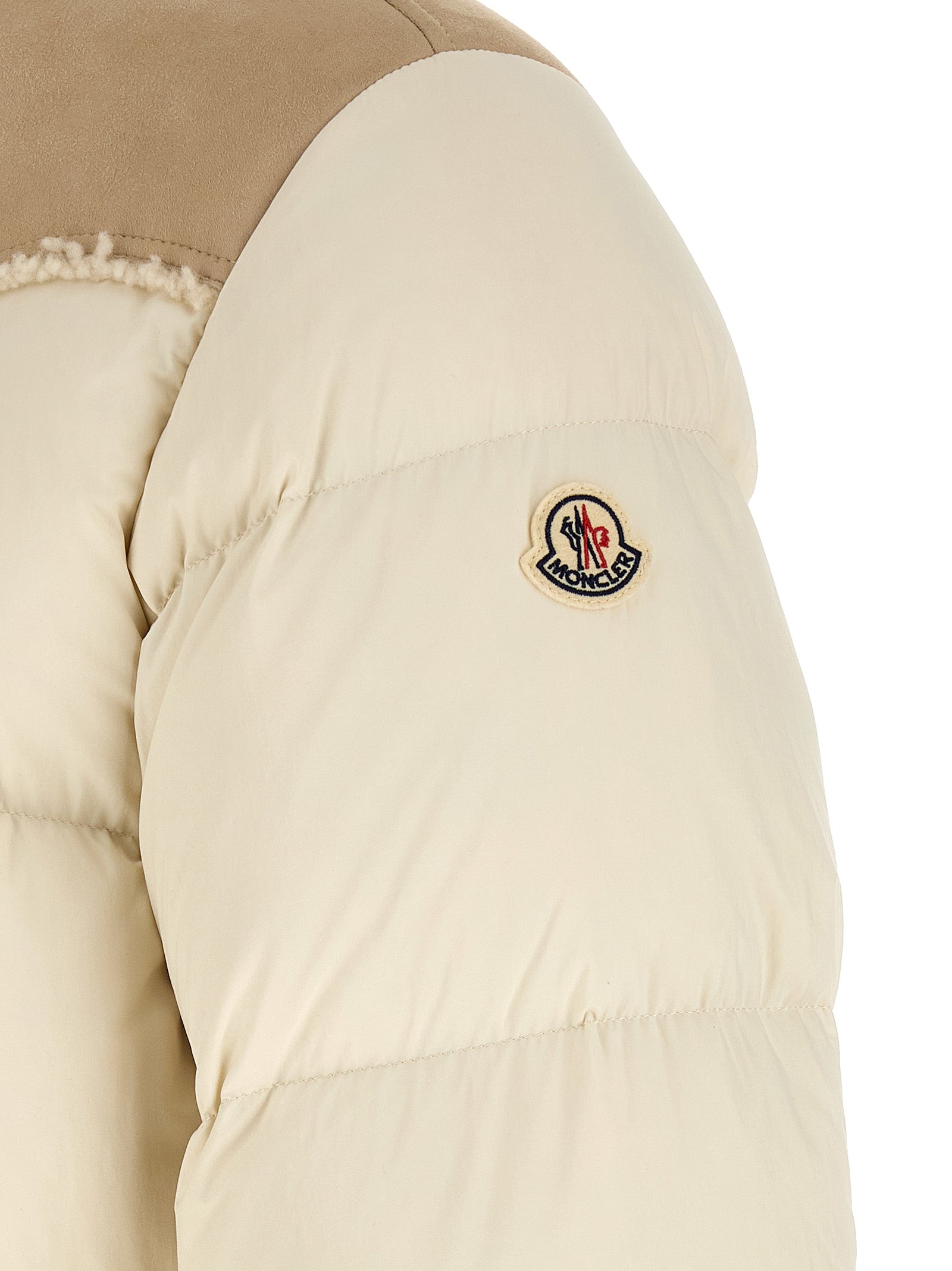 Indulge in the Moncler Beige Polyamide Full-Length Jacket, a masterpiece of luxurious quilted nylon and premium goose down, embodying sophistication and warmth for discerning tastes.