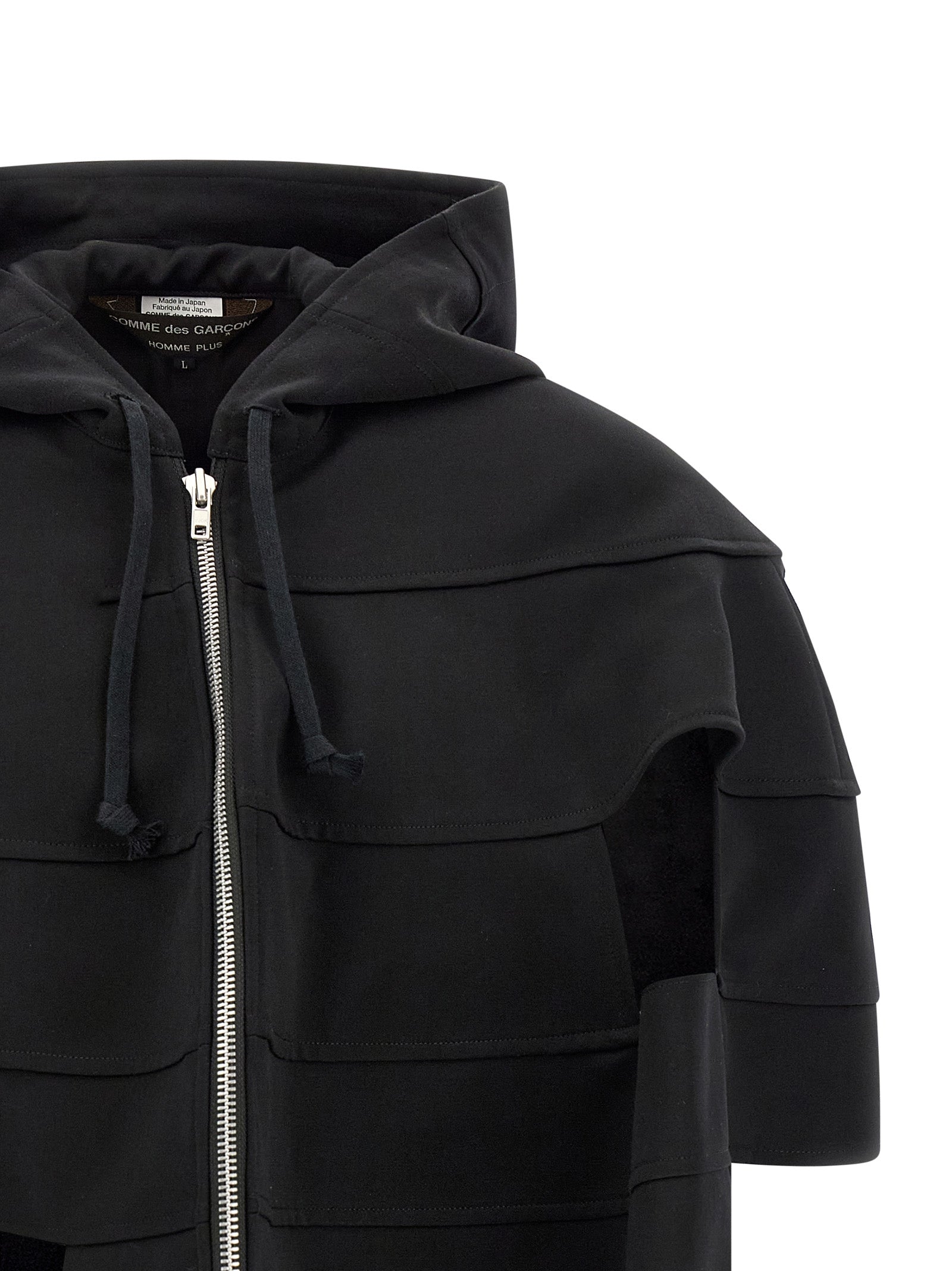 Discover the Comme Des Garçons Black Wool Shell Jacket, a masterpiece of avant-garde craftsmanship and luxurious comfort, perfect for the discerning individual who embraces bold elegance.