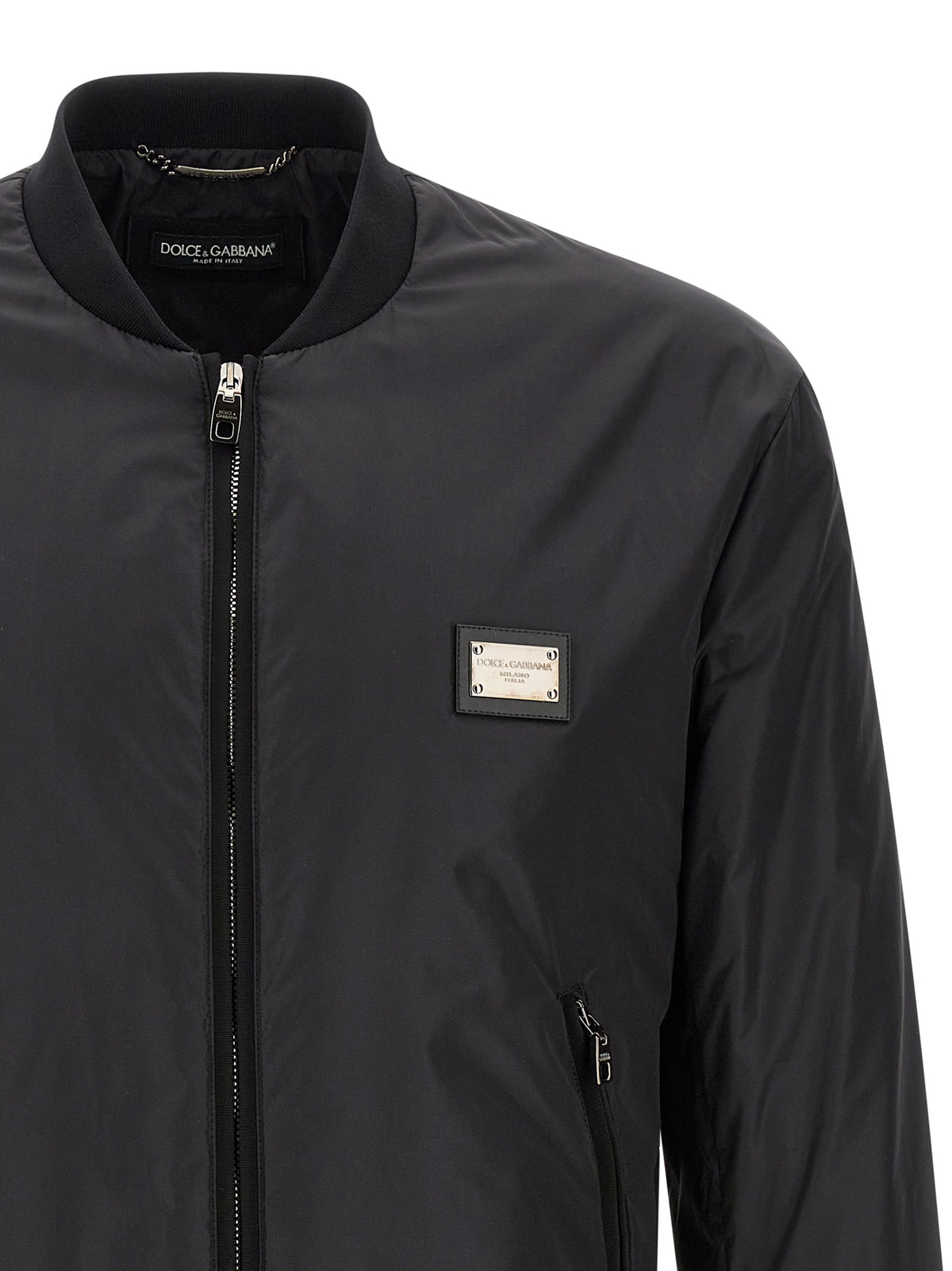 Elevate your wardrobe with the Dolce & Gabbana Black Polyamide Bomber, a masterpiece of Italian craftsmanship that embodies timeless luxury and sophisticated style.