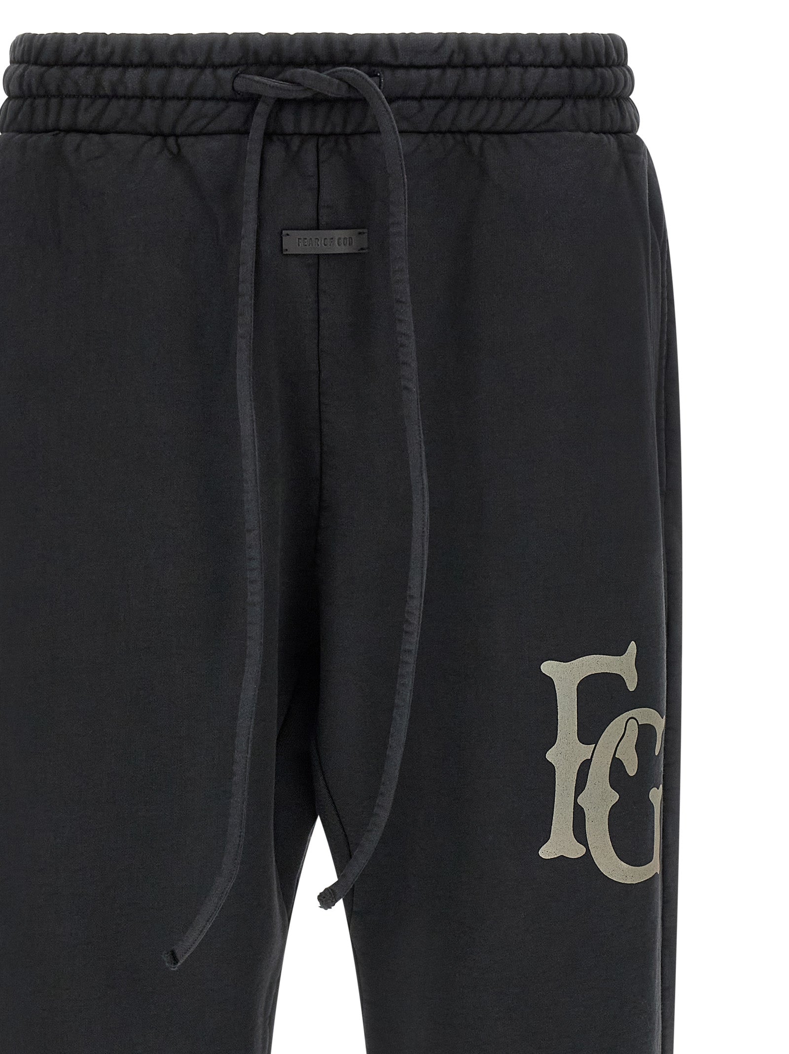 Elevate your wardrobe with Fear Of God Black Cotton Joggers, crafted from premium heavy cotton, blending luxury with effortless style for the discerning individual.