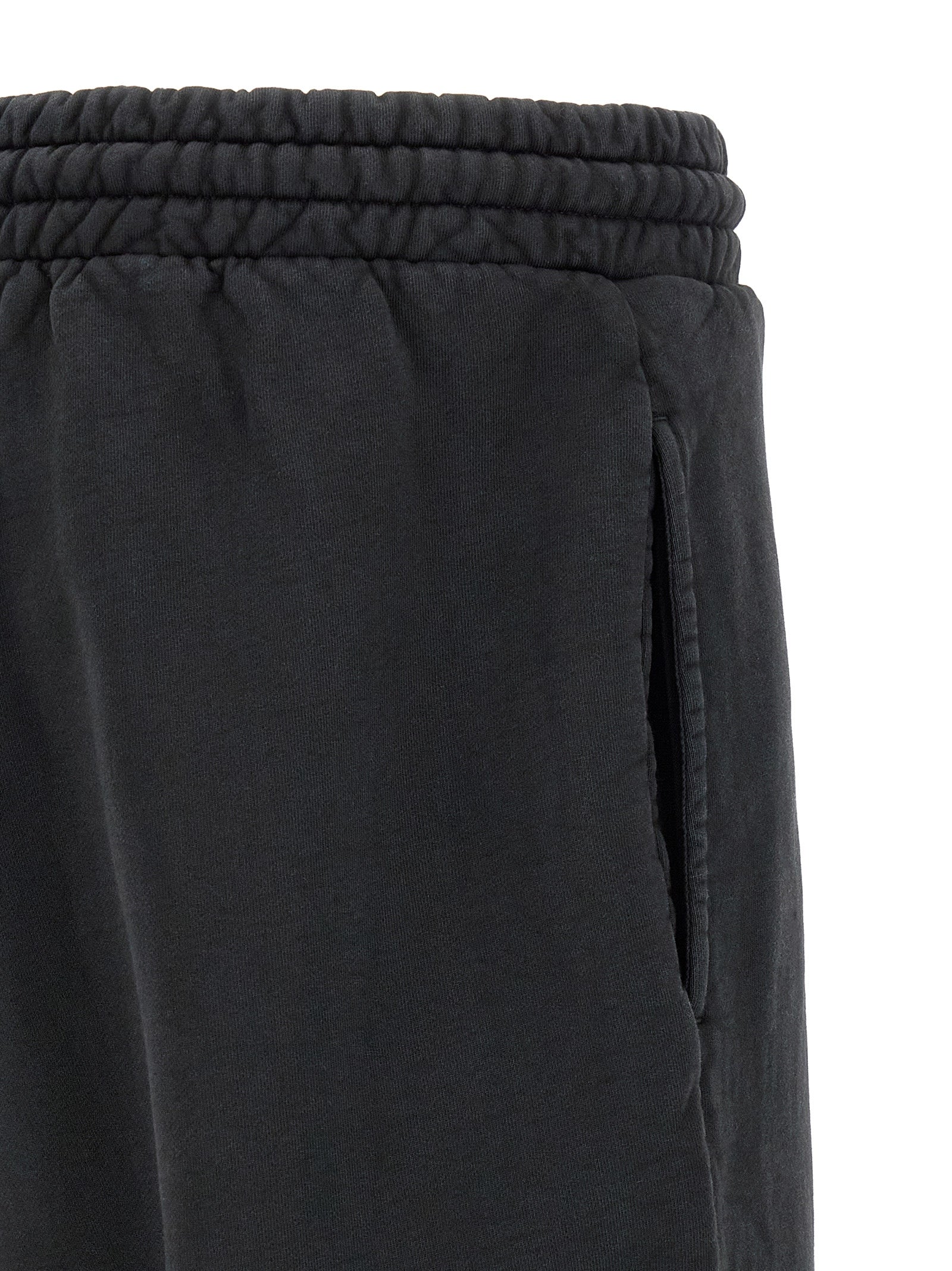 Elevate your wardrobe with Fear Of God Black Cotton Joggers, crafted from premium heavy cotton for a luxurious blend of comfort and style, perfect for any occasion.