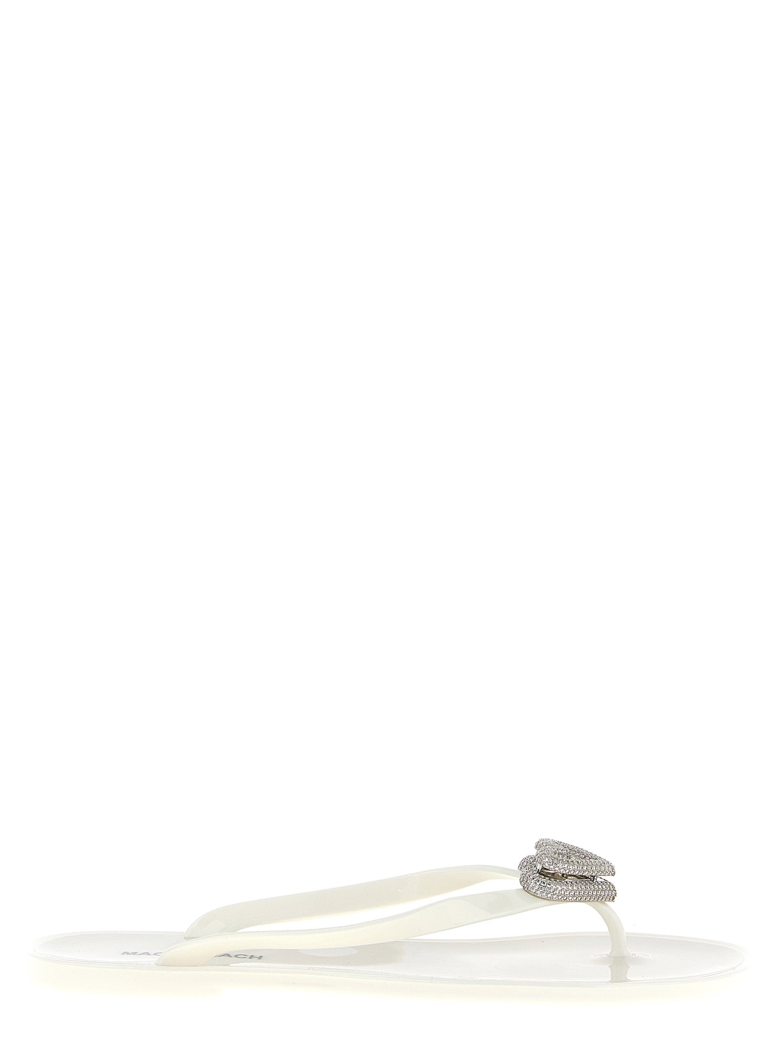 Elevate your style with MACH & MACH White PVC Slides, featuring a dazzling crystal-embellished ‘Double Heart’ detail, perfect for those who embrace luxury and glamour.