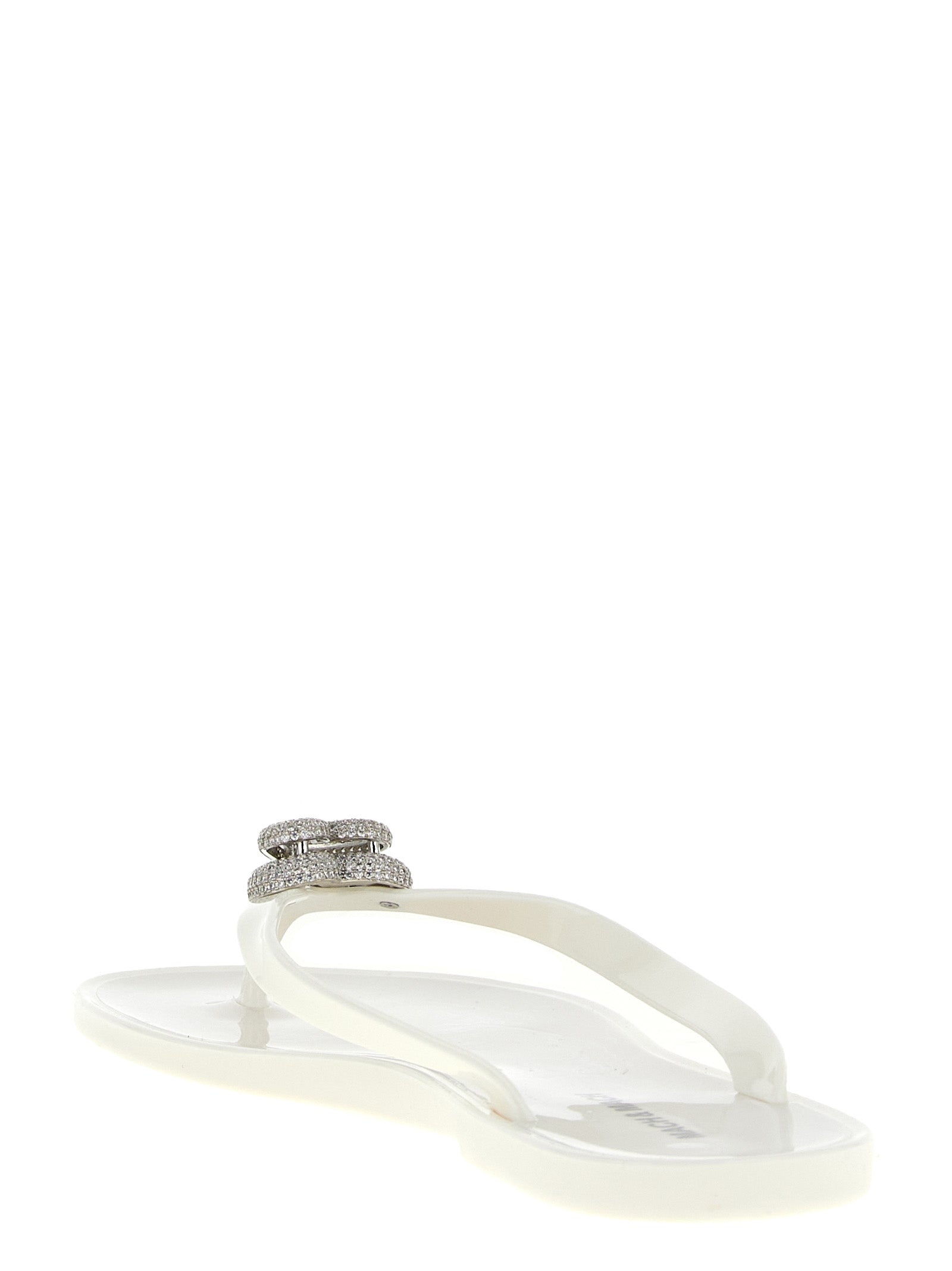 Elevate your style with MACH & MACH White PVC Slides, featuring exquisite crystal-adorned double heart details, perfect for those who embrace luxury and sophistication.
