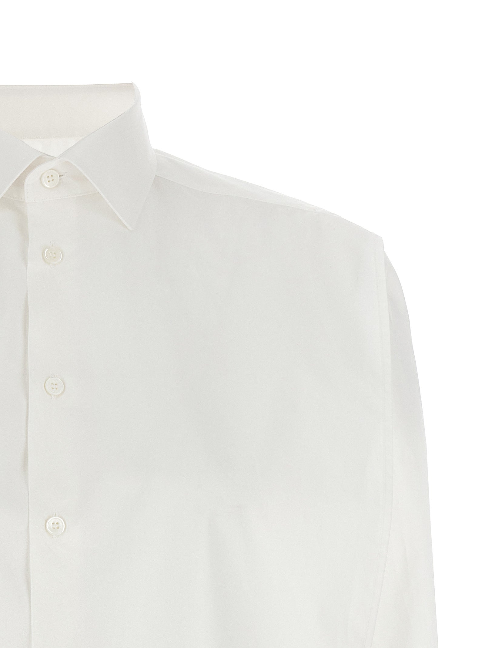 Elevate your wardrobe with the MM6 Maison Margiela White Cotton Blouse, a timeless blend of minimalist design and avant-garde sophistication, crafted in Italy.
