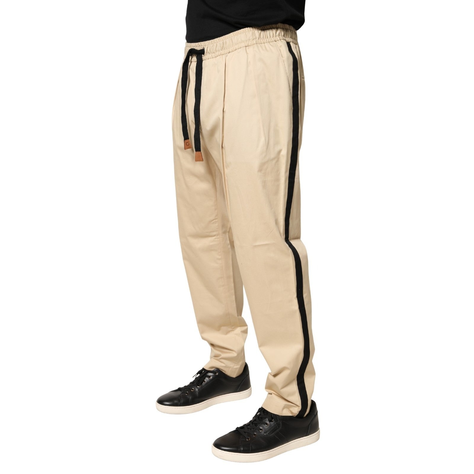 Elevate your style with Dolce & Gabbana's beige cotton skinny jogger trousers, where exquisite Italian craftsmanship meets luxurious comfort for the modern connoisseur.