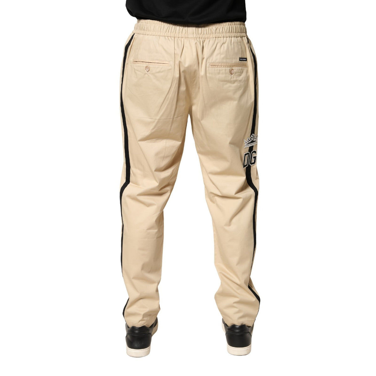 Indulge in the refined elegance of Dolce & Gabbana's beige cotton skinny jogger trousers, a testament to Italian craftsmanship that elevates your sophisticated style.