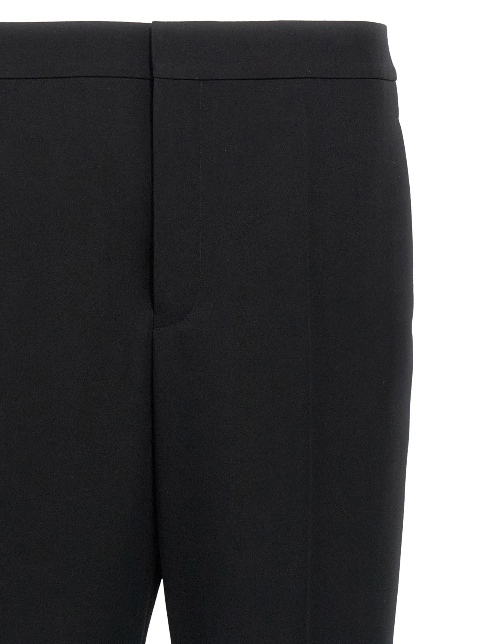 Elevate your wardrobe with Saint Laurent Black Wool Dress Pants, a masterpiece of Italian craftsmanship that embodies timeless sophistication and luxurious elegance.