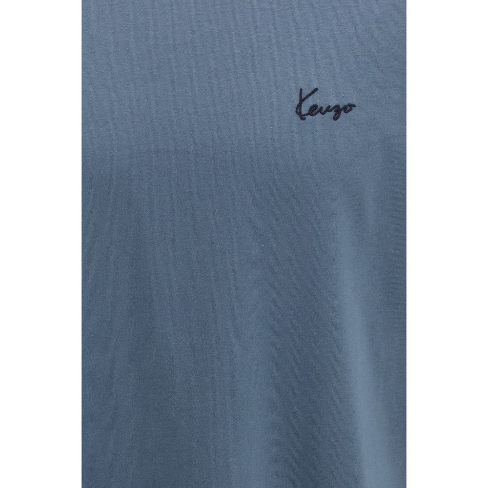 Elevate your wardrobe with the Kenzo Blue Cotton T-Shirt, a luxurious blend of soft cotton jersey, embodying sophistication and effortless elegance for every occasion.