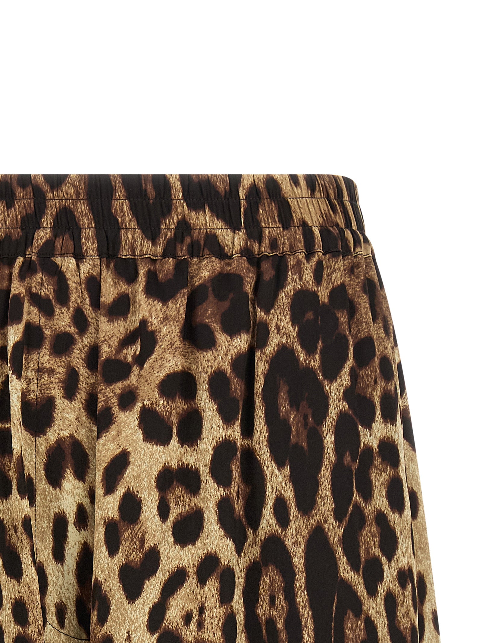 Indulge in the luxurious allure of Dolce & Gabbana Brown Silk Bermuda Shorts, where exquisite craftsmanship meets bold style, perfect for the discerning individual.