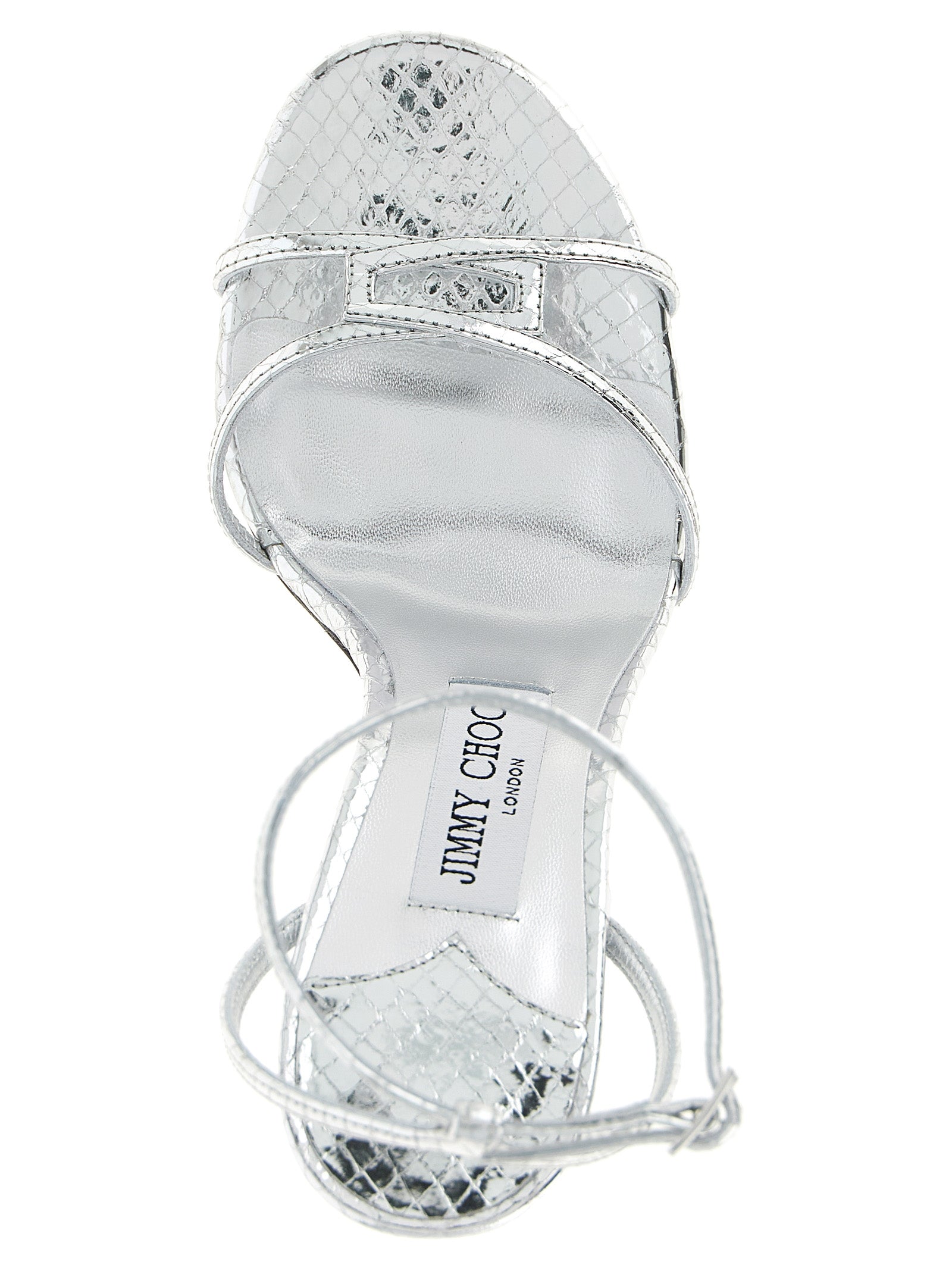 Experience the allure of Jimmy Choo's Silver Leather Stiletto Heel Sandals, a 1998 masterpiece crafted in Italy, blending luxurious materials for timeless elegance.