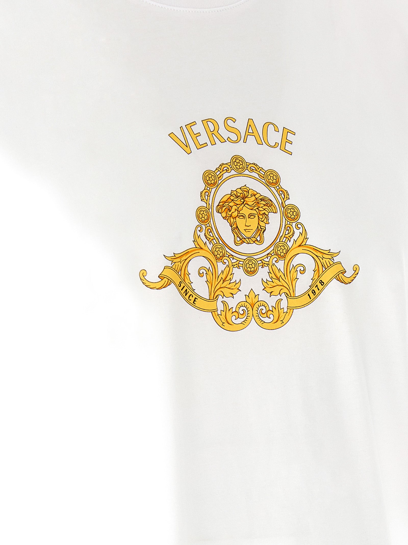 Elevate your wardrobe with the Versace Hall of Heroes Crest T-Shirt, a luxurious cotton essential that embodies sophistication and timeless style for discerning individuals.