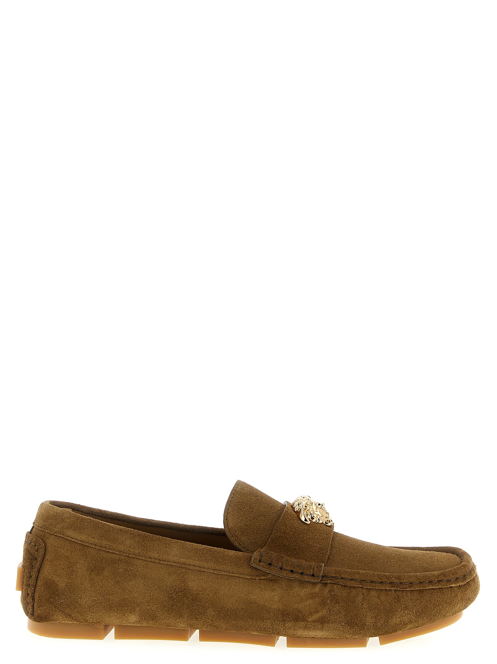 Indulge in the opulence of Versace's Brown Calfskin Slip-On Loafers, where exquisite craftsmanship meets timeless elegance for the discerning trendsetter.