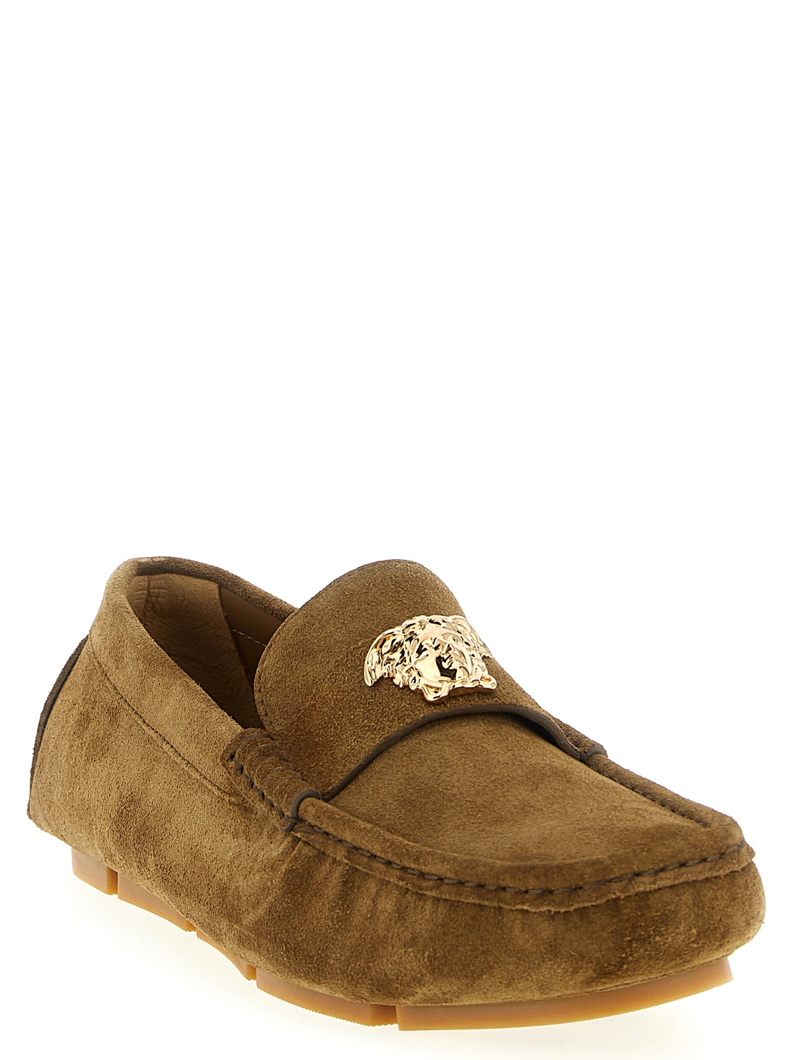Experience the allure of Versace's Brown Calfskin Slip-On Loafers, where exquisite craftsmanship meets timeless elegance, perfect for the discerning trendsetter.