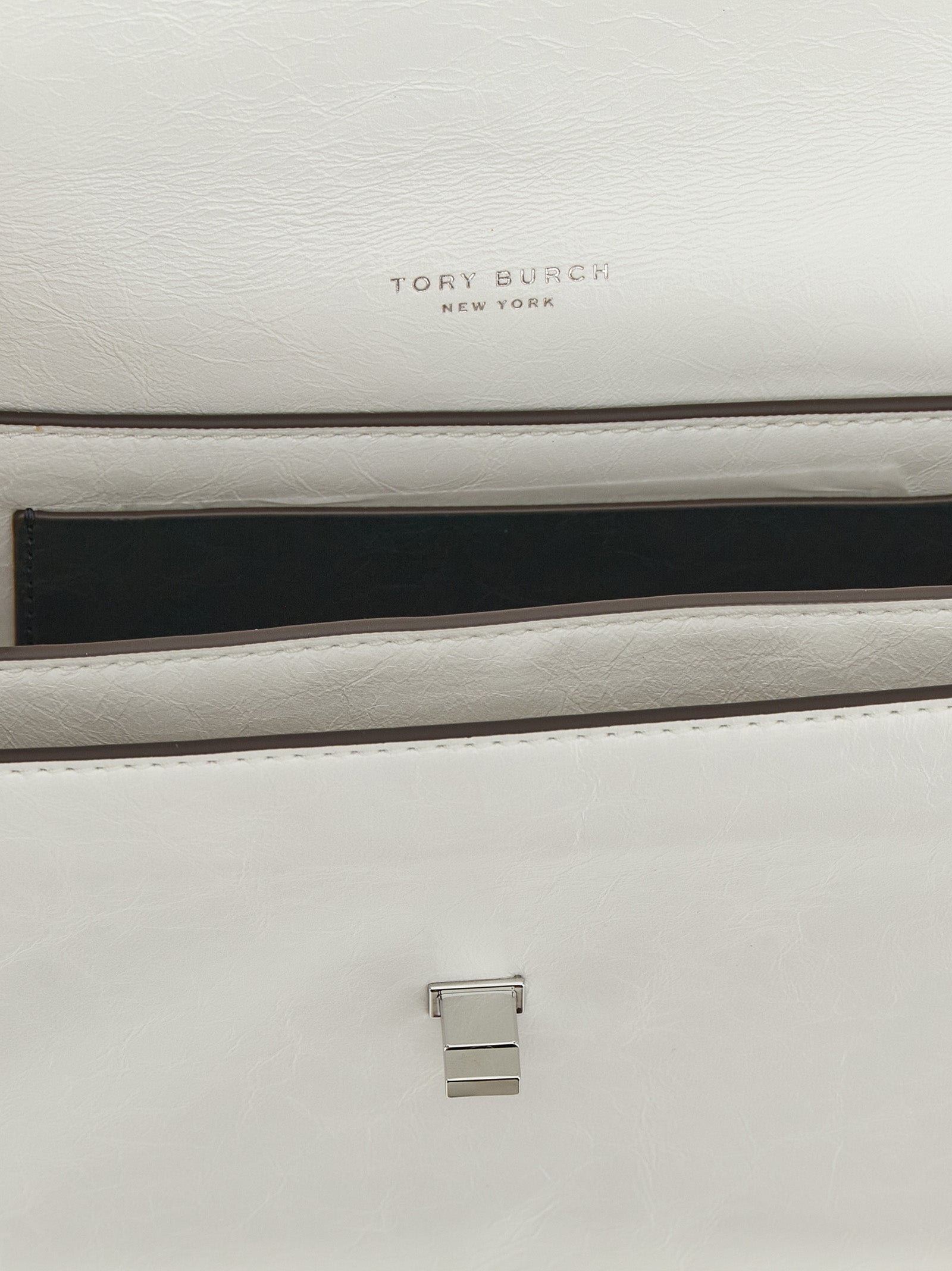 Elevate your style with the Tory Burch White Lamb Leather Shoulder Bag, a masterpiece of exquisite craftsmanship and timeless elegance, perfect for any occasion.