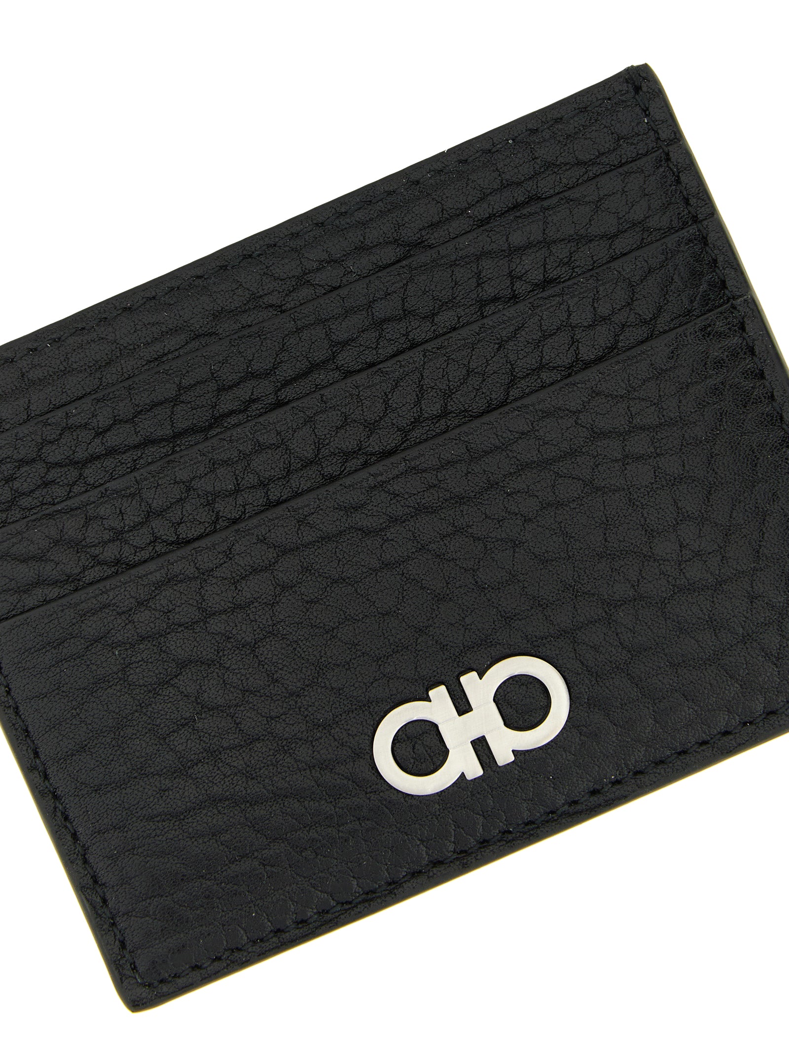 Experience the allure of the Ferragamo Black Calfskin Cardholder, a testament to Italian craftsmanship, blending luxury with practicality for the discerning individual.