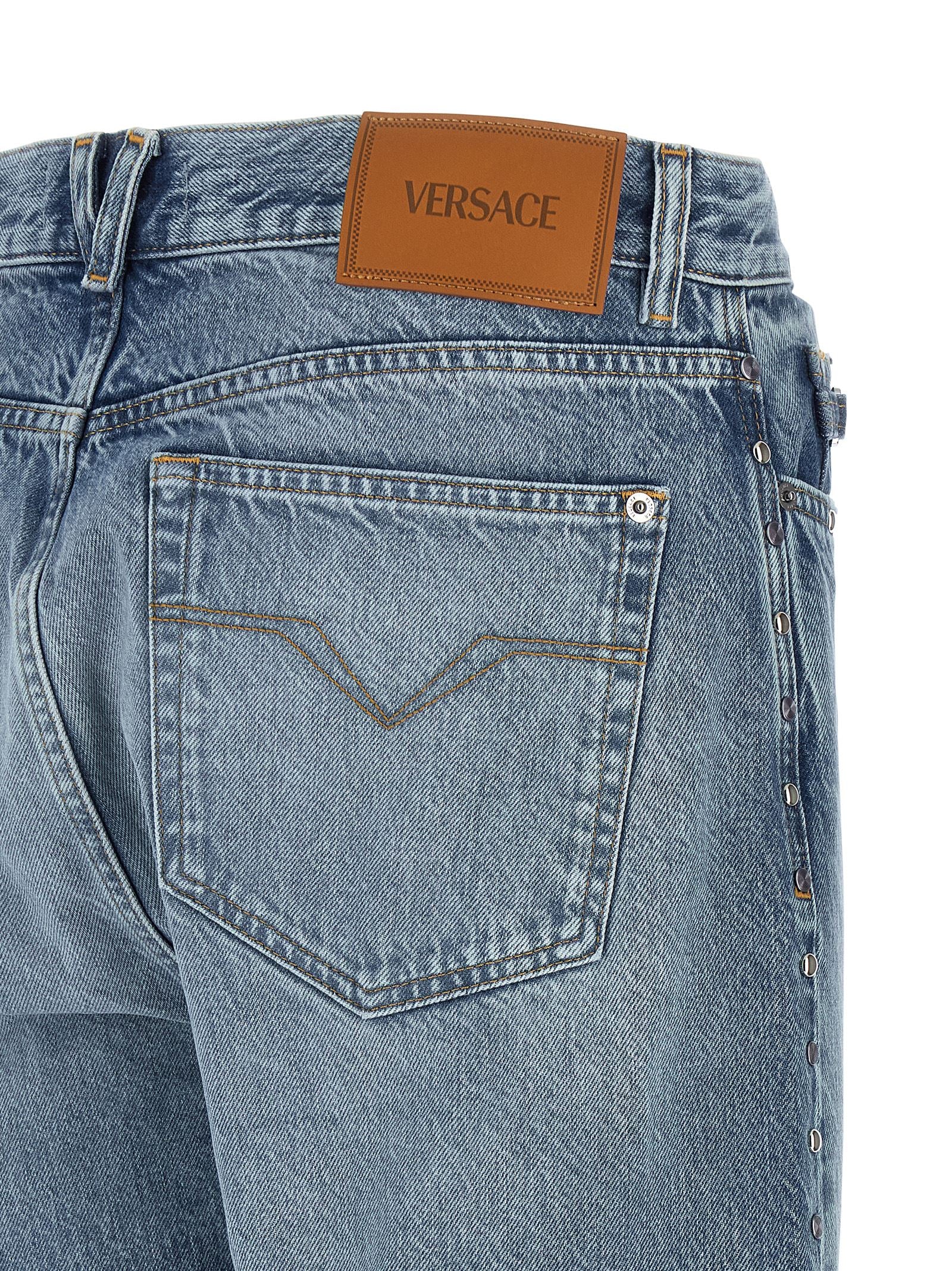 Elevate your style with Versace Blue Cotton Straight-Leg Jeans, where exquisite craftsmanship meets modern luxury, perfect for the discerning individual.