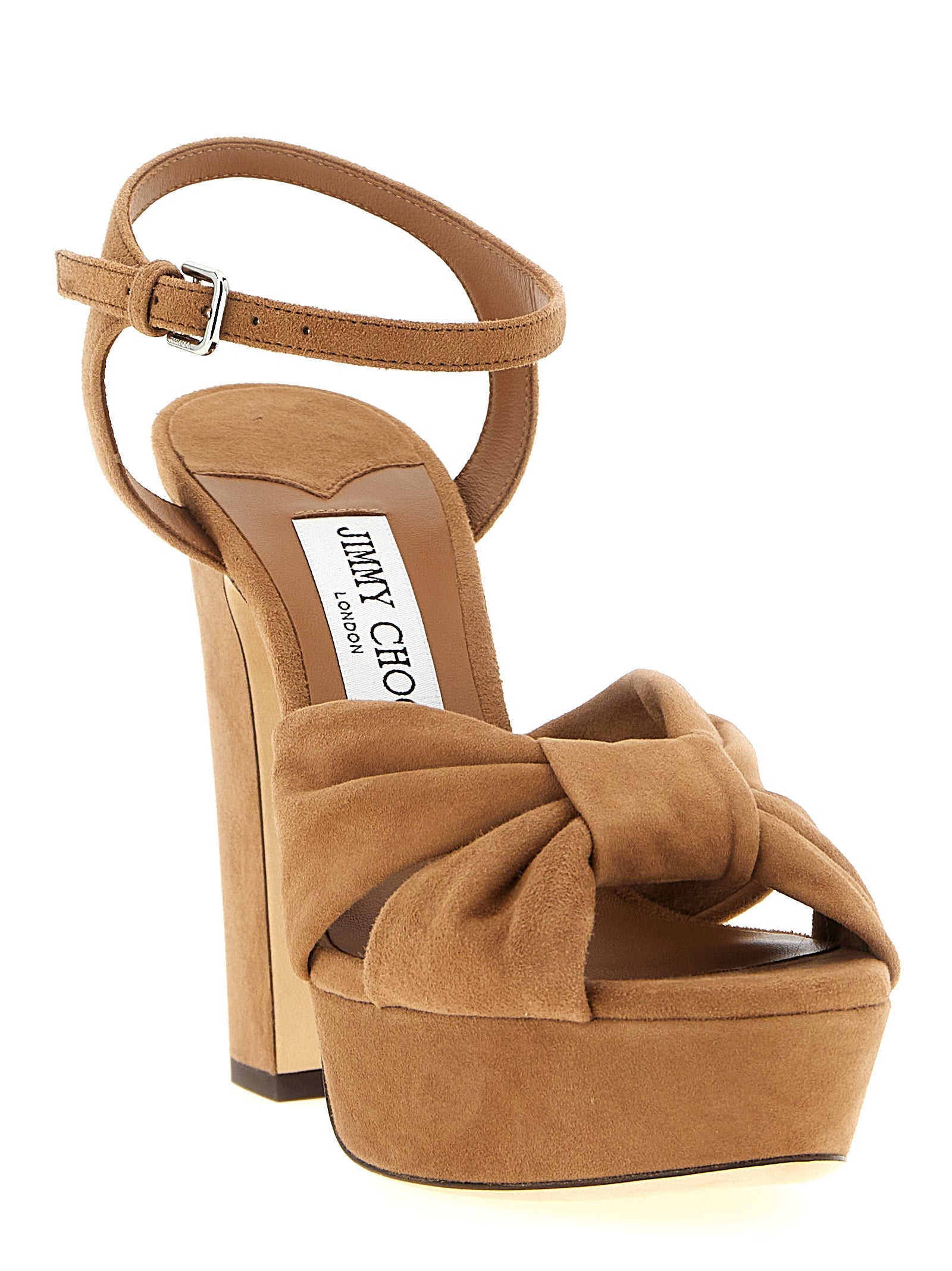 Indulge in the exquisite craftsmanship of Jimmy Choo's Heloise brown leather stiletto heel sandals, where Italian luxury meets timeless elegance for the discerning individual.