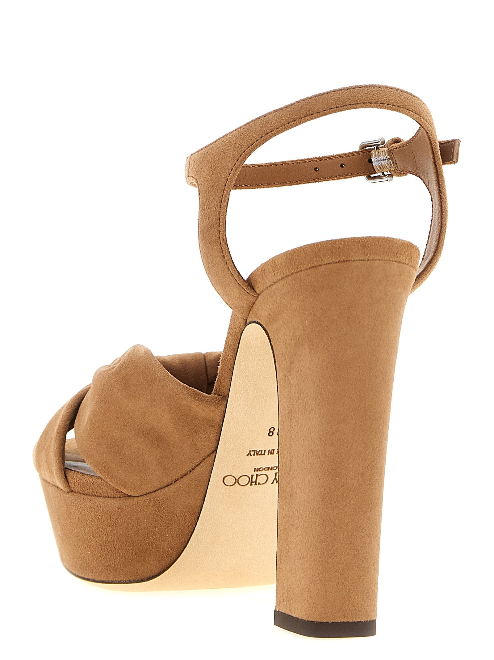 Indulge in the exquisite craftsmanship of Jimmy Choo's Heloise brown leather stiletto heel sandals, where Italian luxury meets timeless elegance for the discerning individual.