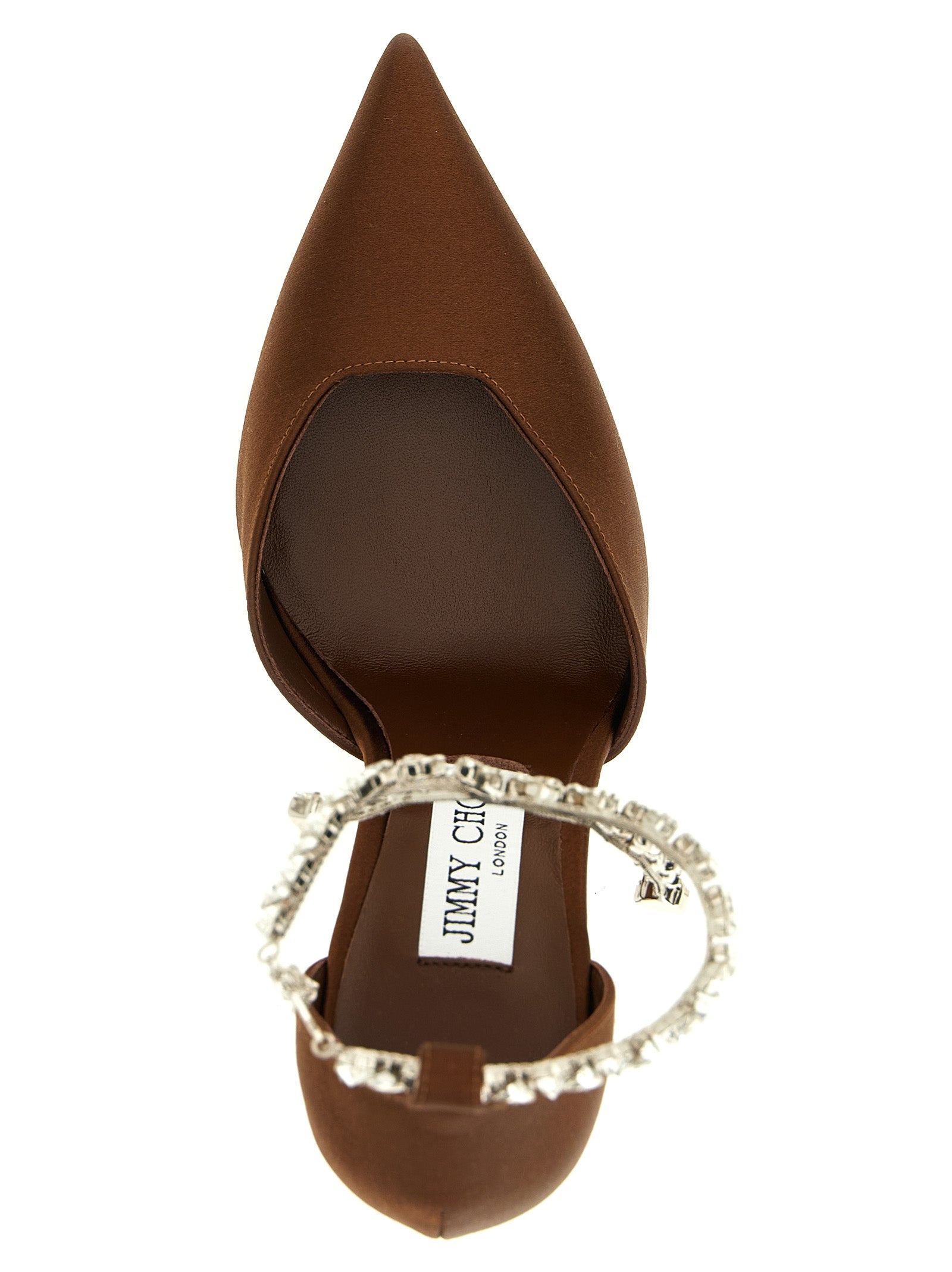 Indulge in the exquisite craftsmanship of Jimmy Choo's Brown Tencel High Heel Pumps, where luxurious materials meet timeless elegance, perfect for any sophisticated occasion.